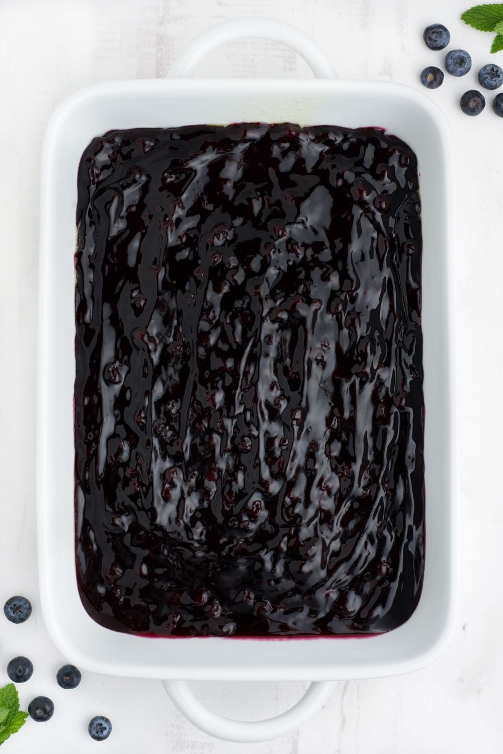 blueberry pie filling spread in pan