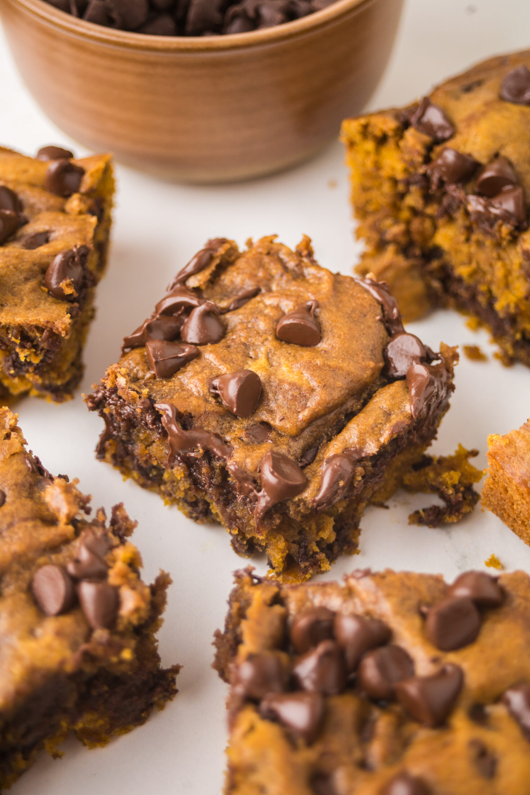 Brown Butter Pumpkin Chocolate Chip Bars sliced on a table