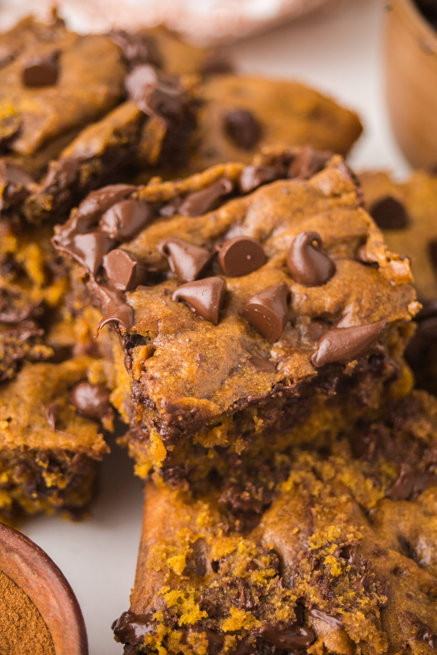 Brown Butter Pumpkin Chocolate Chip Bars stacked and sliced