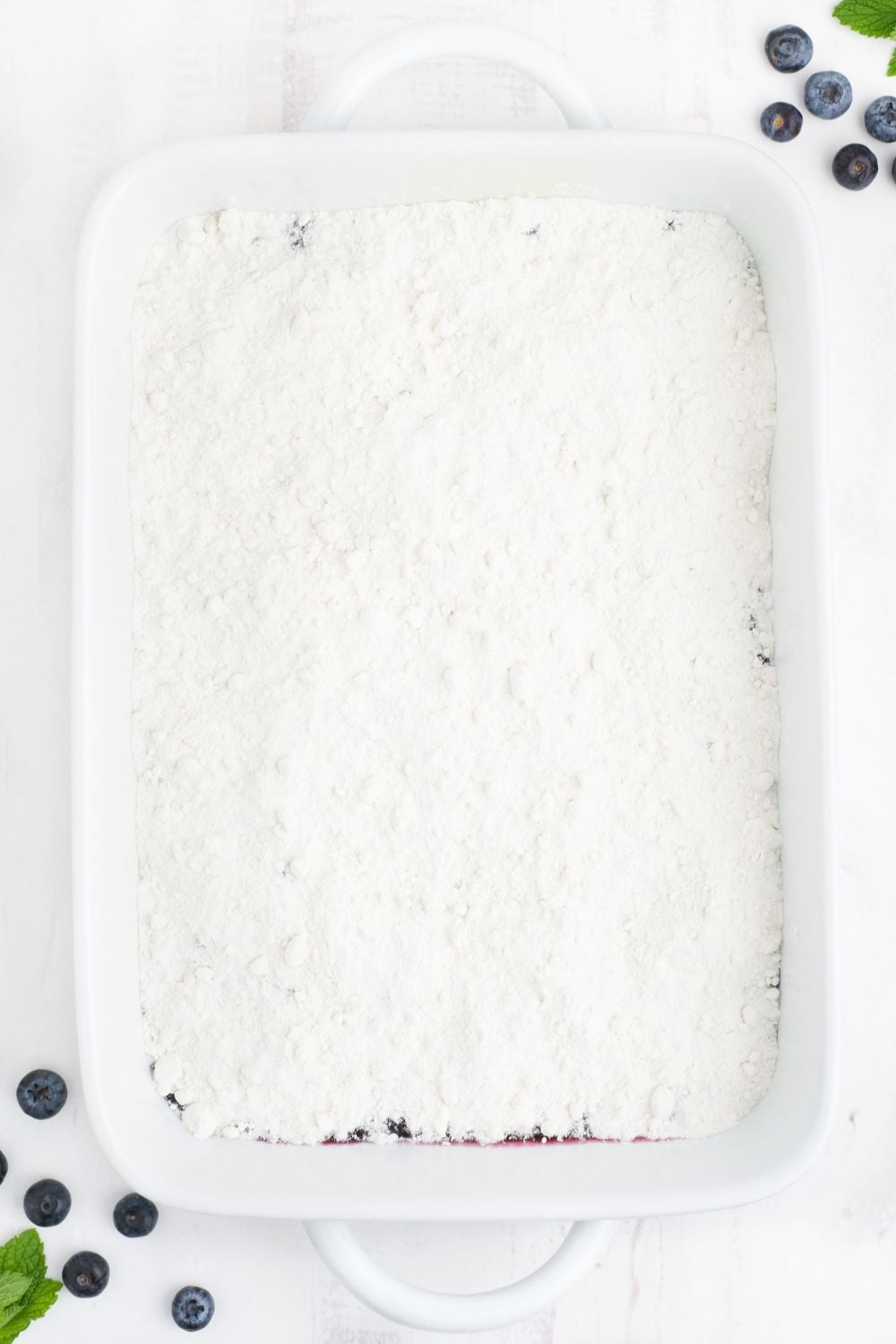 cake mix spread over the top of the cake pan