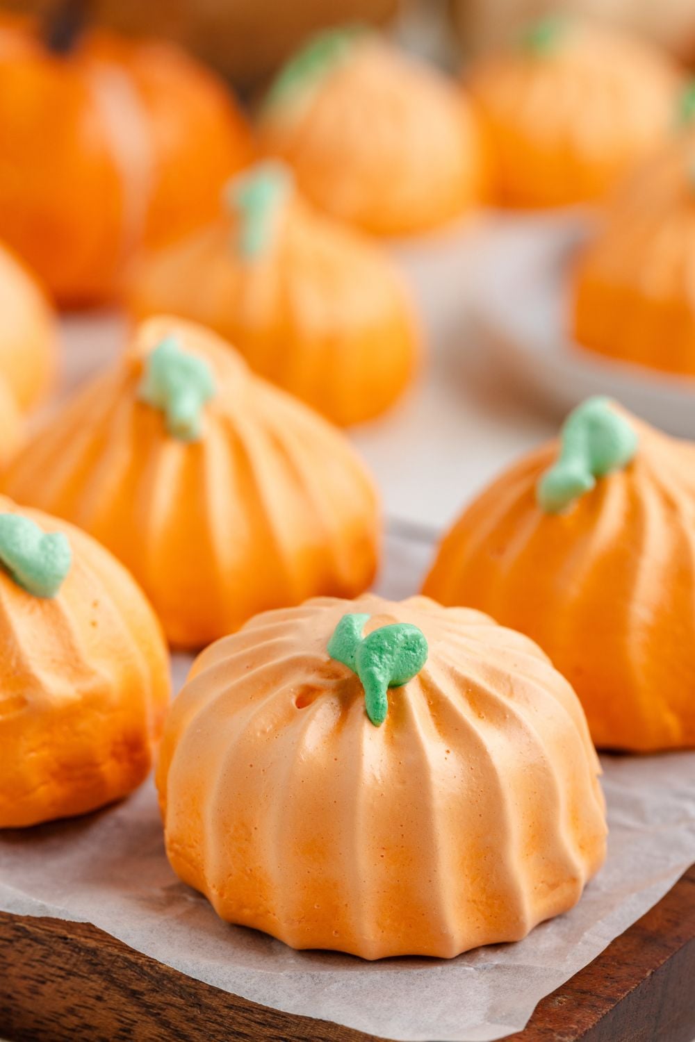 side view of Pumpkin Meringues placed in a single row on tray