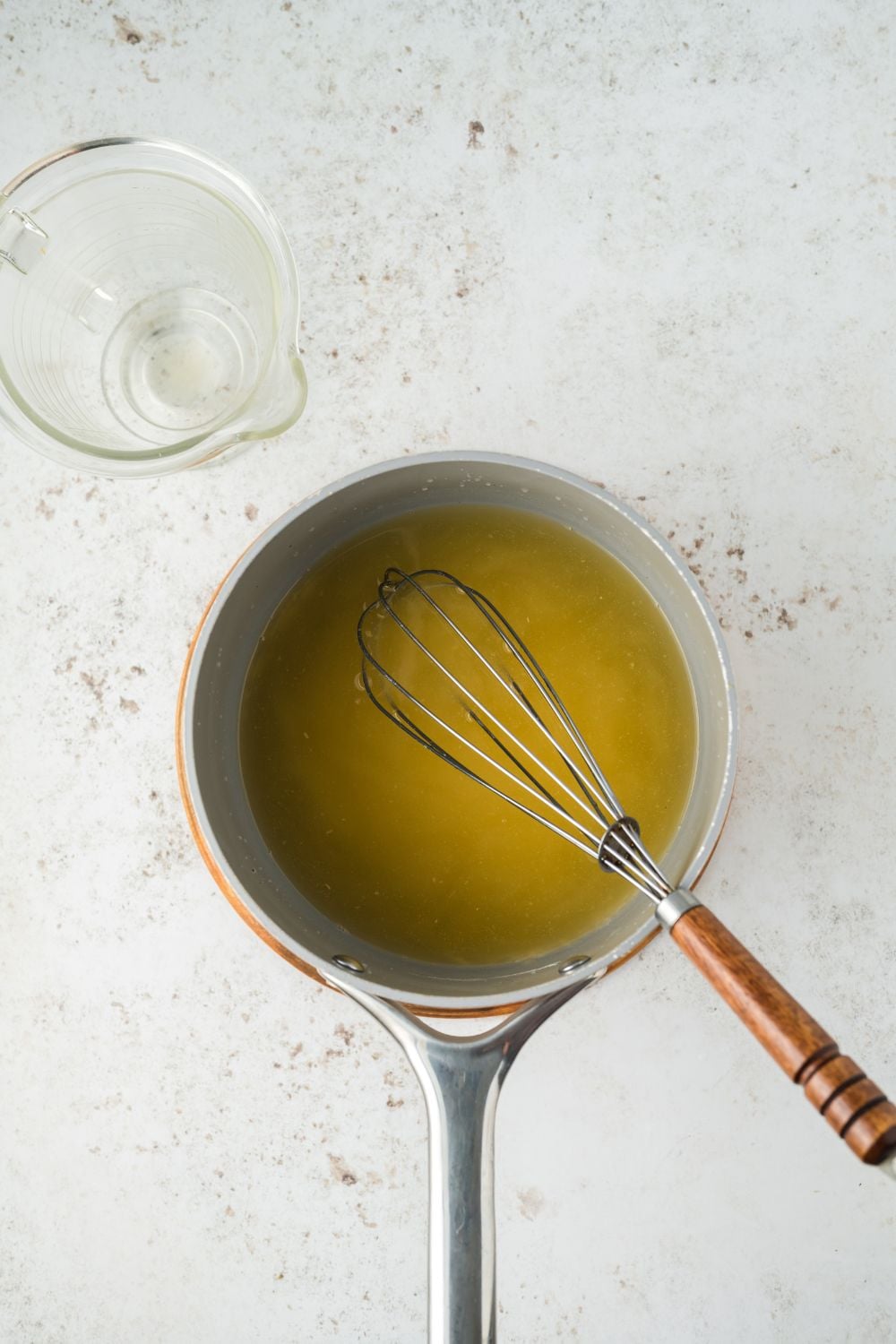 small pan on a marble counter making a gravy for turkey