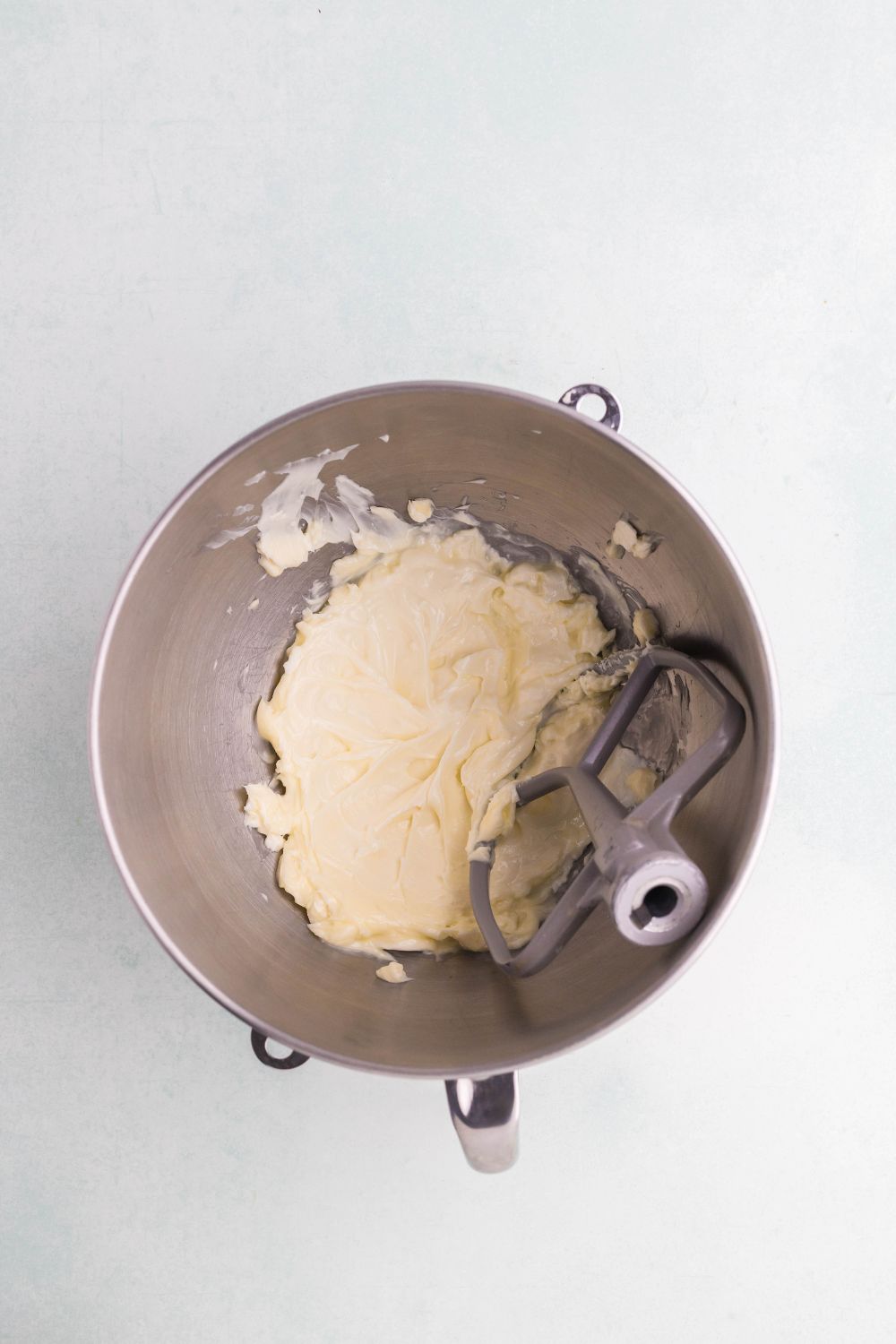 butter creamed in a metal mixing bowl