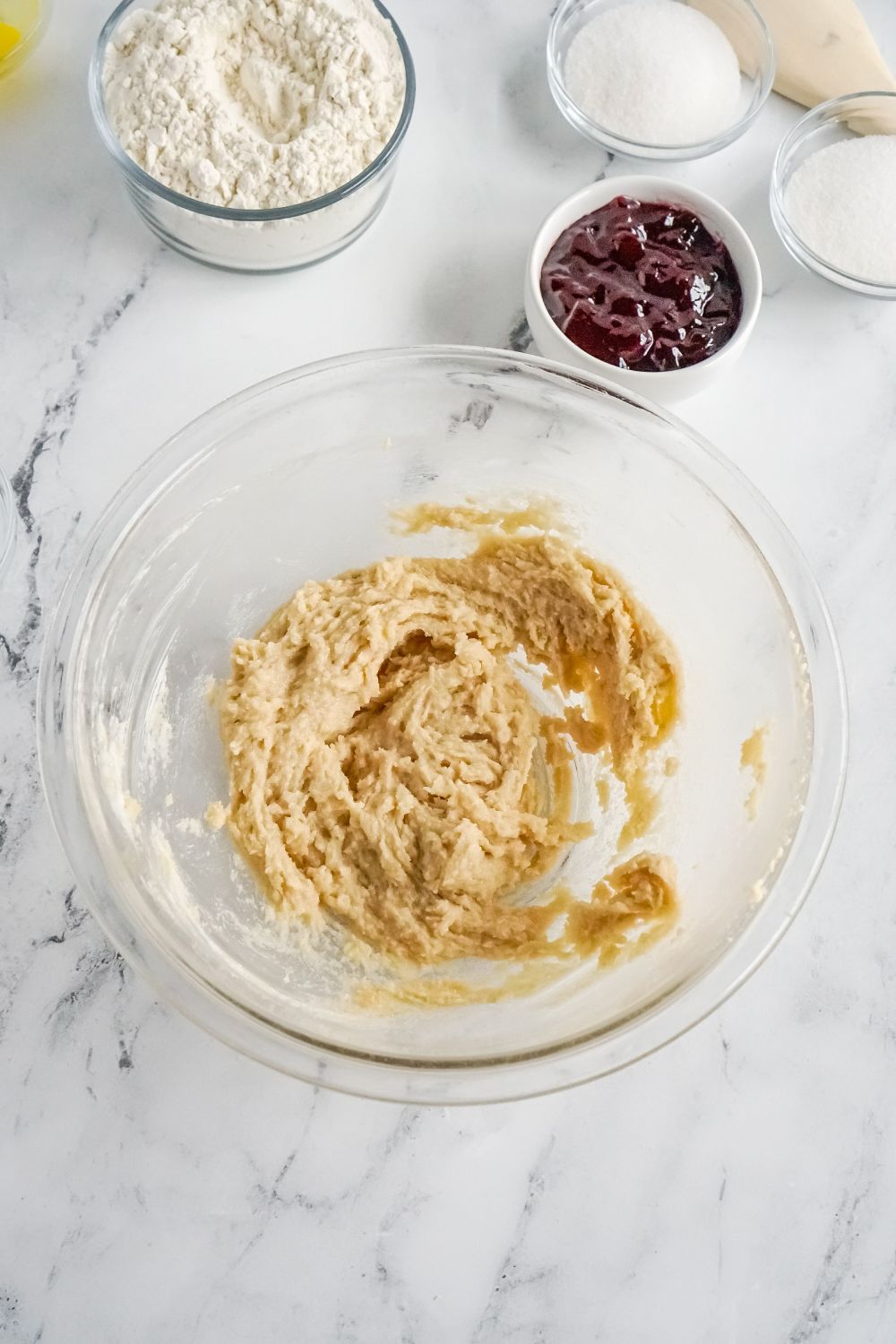 Raspberry Thumbprint Cookie dough in a glass bowl on table