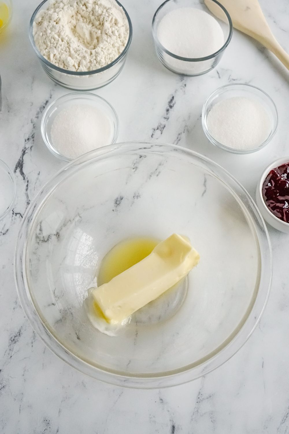 melted butter in a glass bowl on marble counter