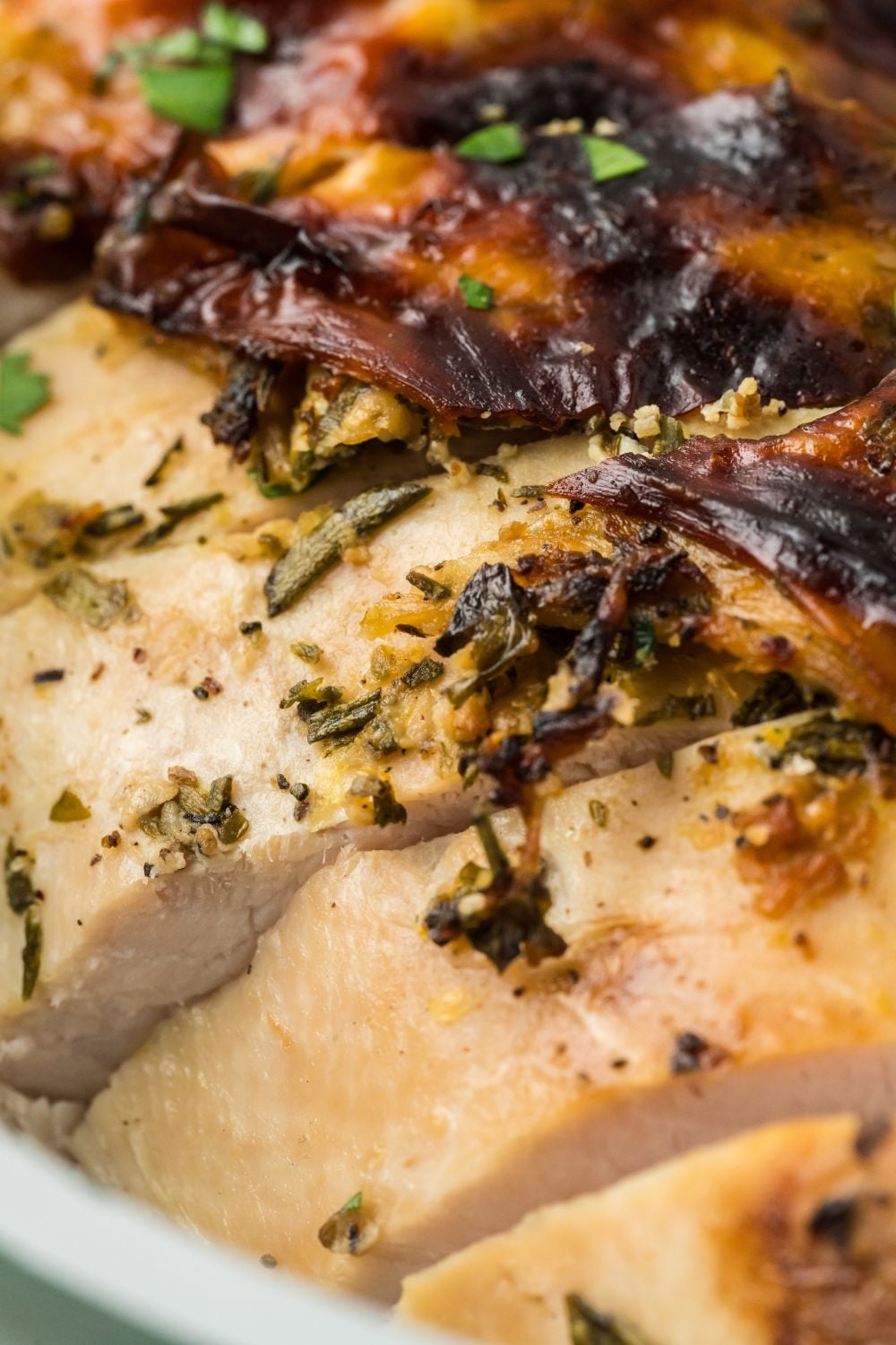 close up of a seasoned and Roasted Turkey Breast that is sliced into pieces