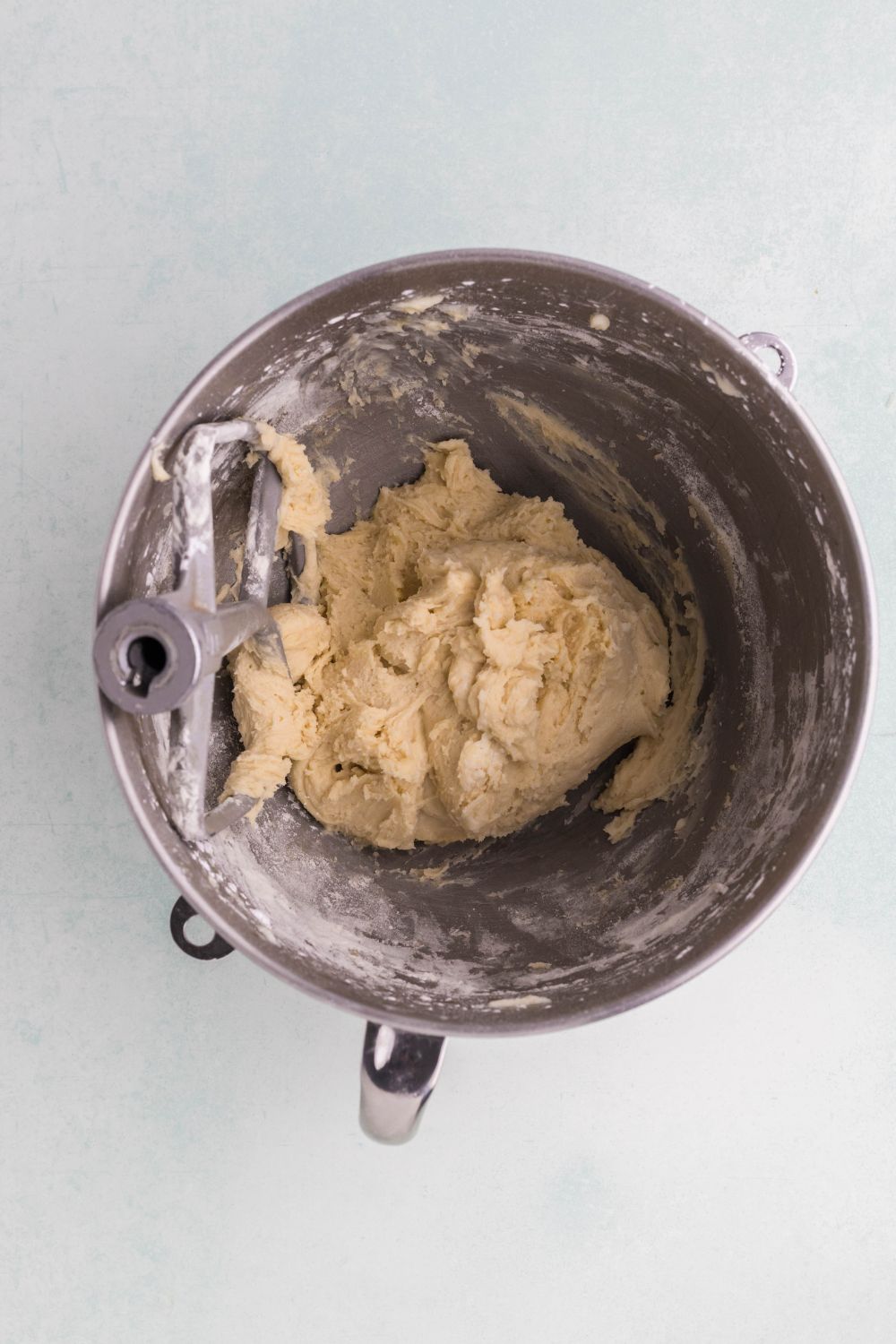 metal mixer bowl full of cookie dough
