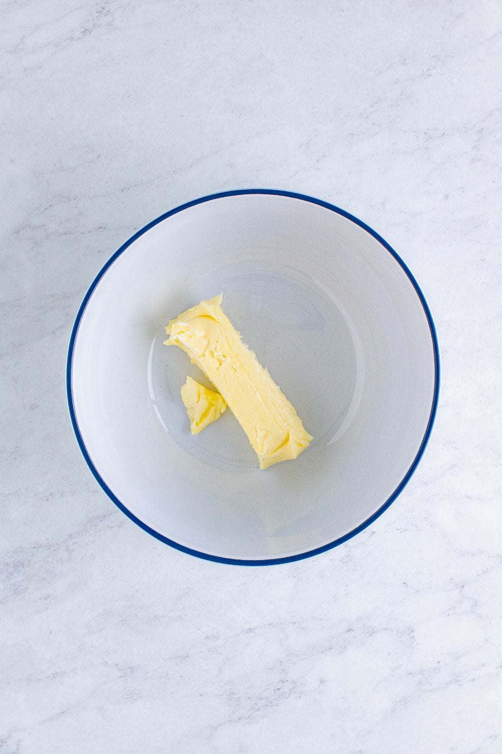 stock of butter in a white bowl on table