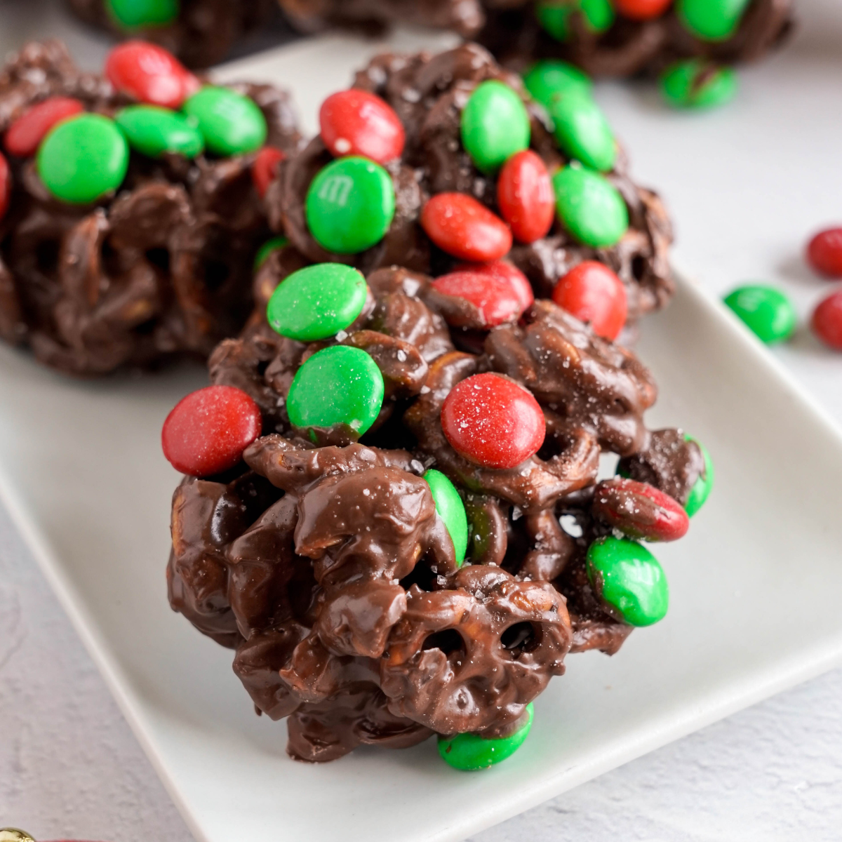 Crockpot Chocolate Pretzel Christmas Candy on a white plate on table