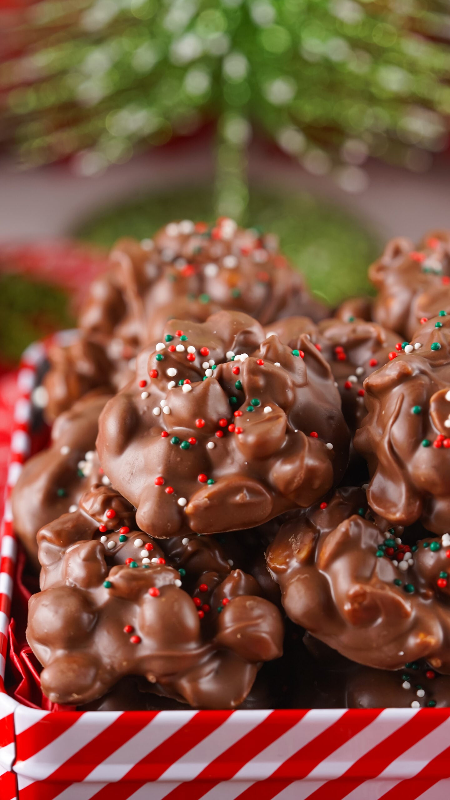 up close shot of the Crockpot Christmas Candy in a striped Cookie Tin