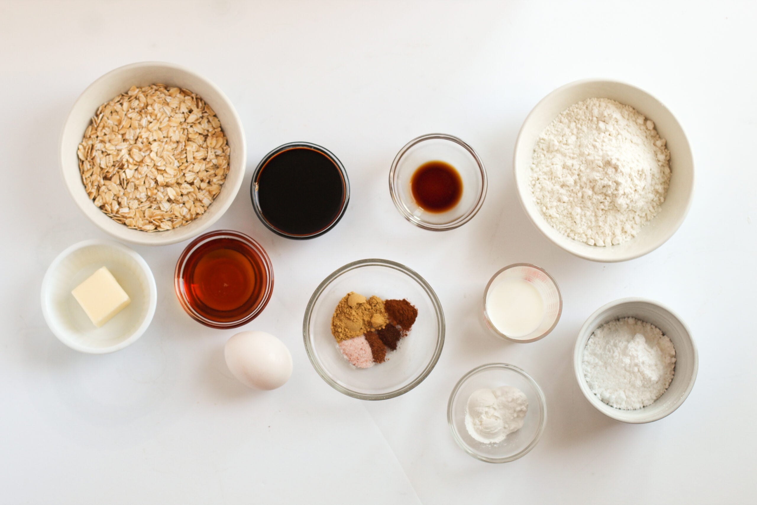 Iced Gingerbread Oatmeal Cookie ingredients on a white table