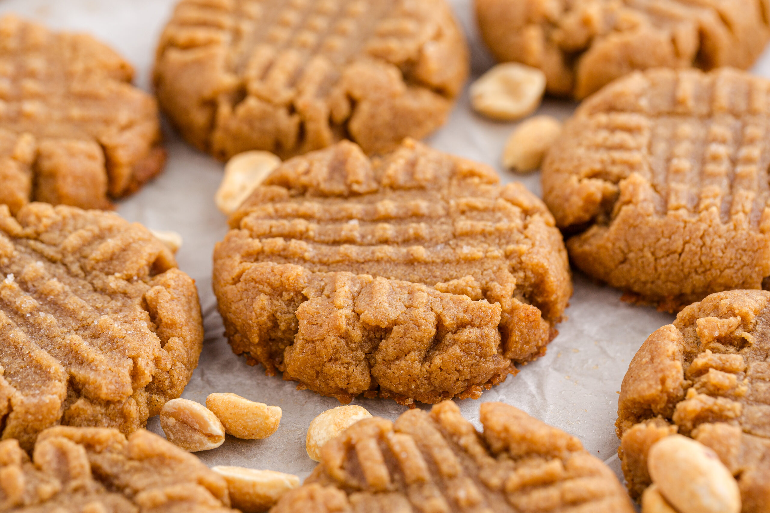 4 Ingredient Peanut Butter Cookies spread out on a table