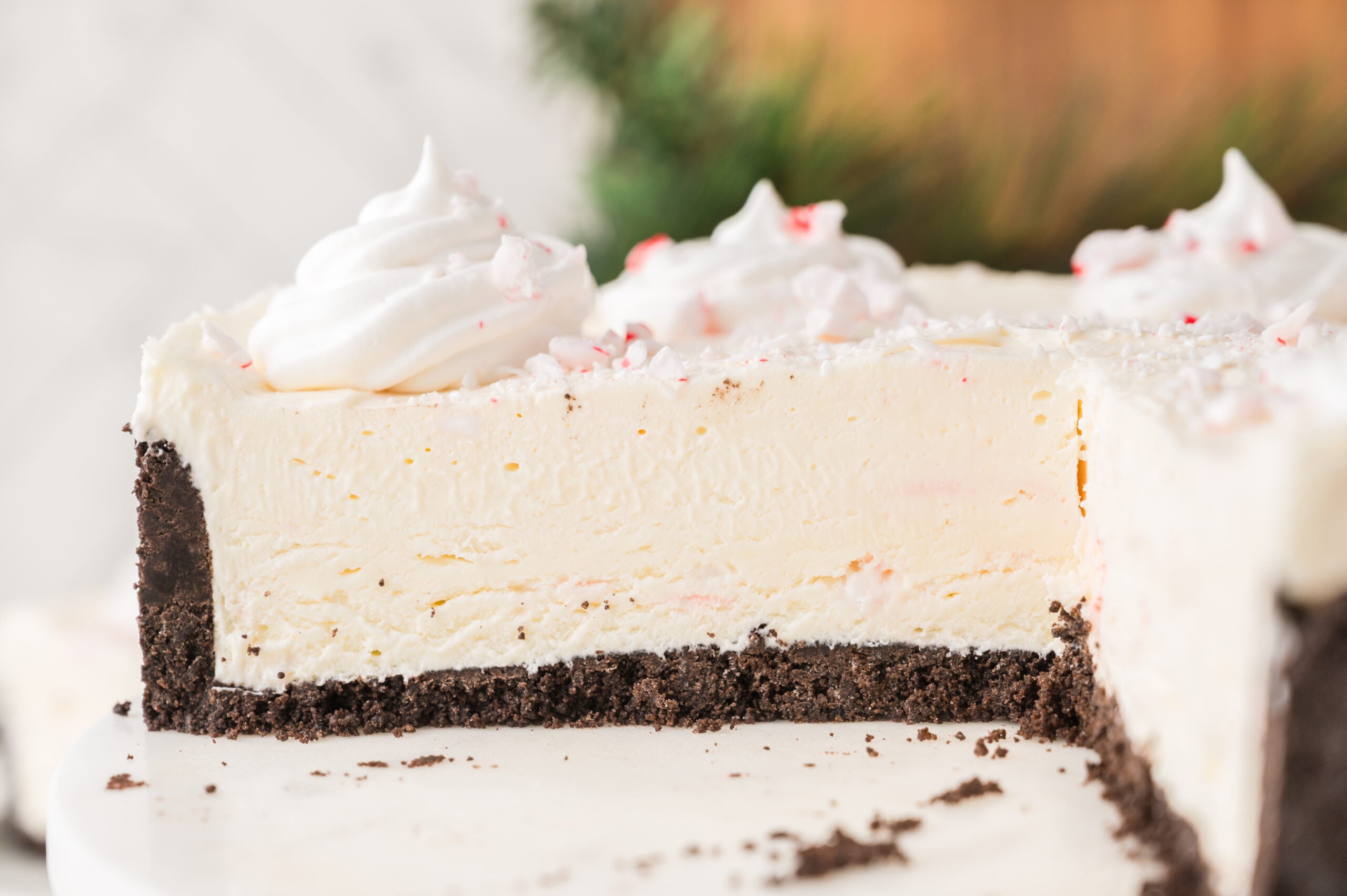 No Bake Peppermint Cheesecake with a slice removed 