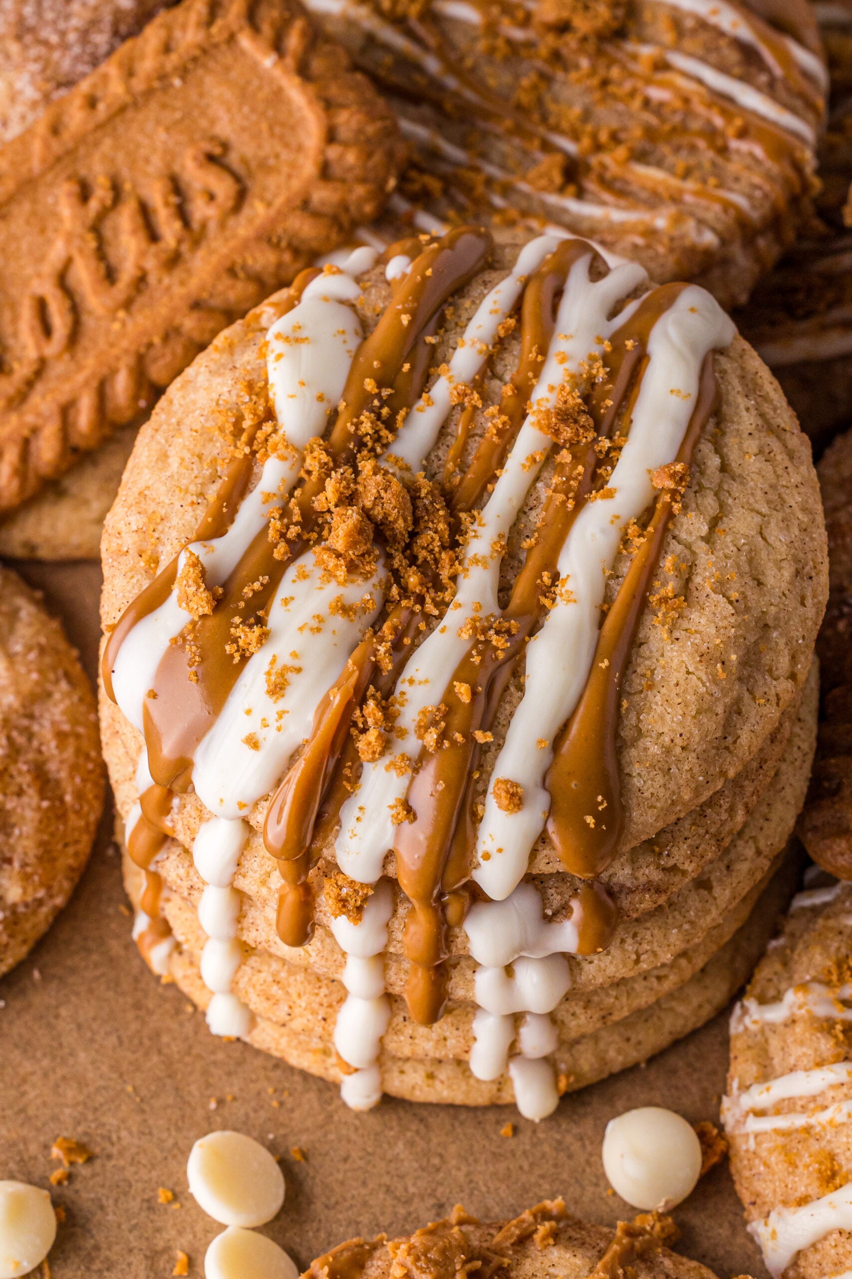 Biscoff Snickerdoodle Cookies drizzled with white chocolate and melted biscoff