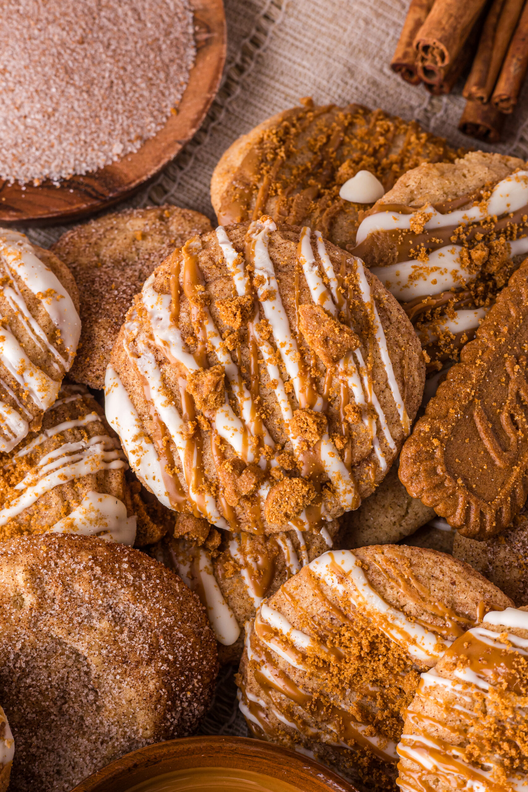 Biscoff Snickerdoodle Cookies spread around the table with cookies