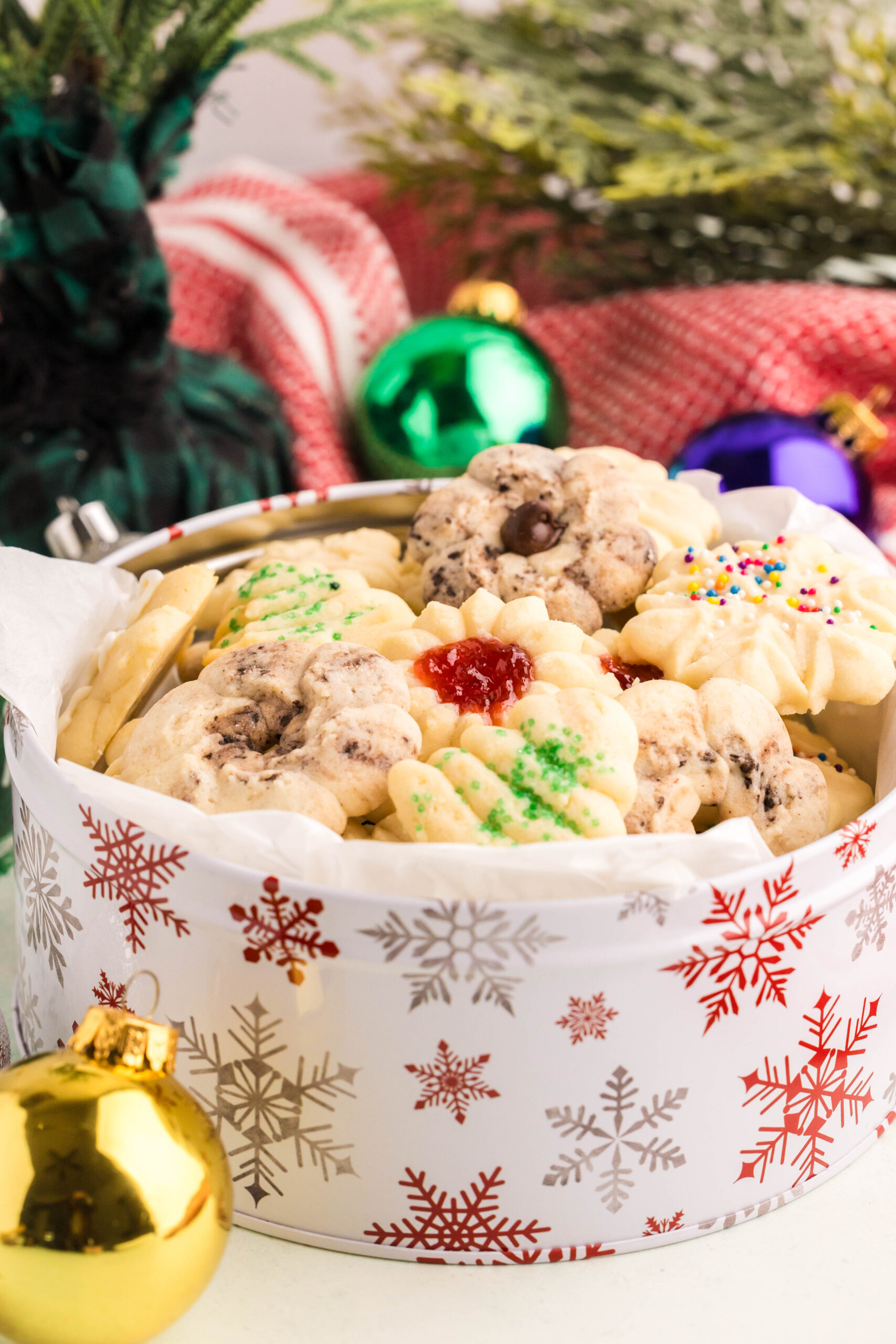 Spritz Christmas Cookies in a Christmas cookie tin