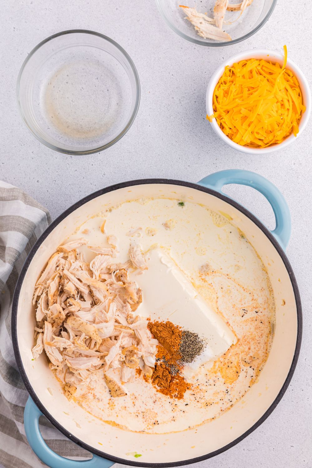 chicken with cream cheese and spices together in a pot