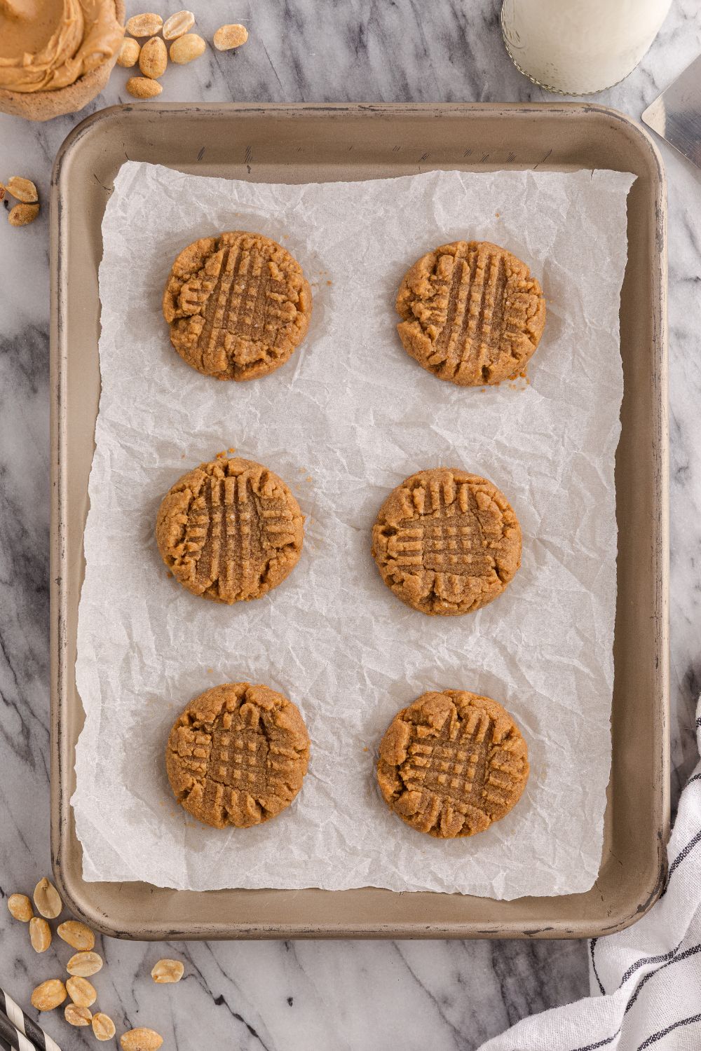 sheet pan with baked 4 Ingredient Peanut Butter Cookies on a cookie tray