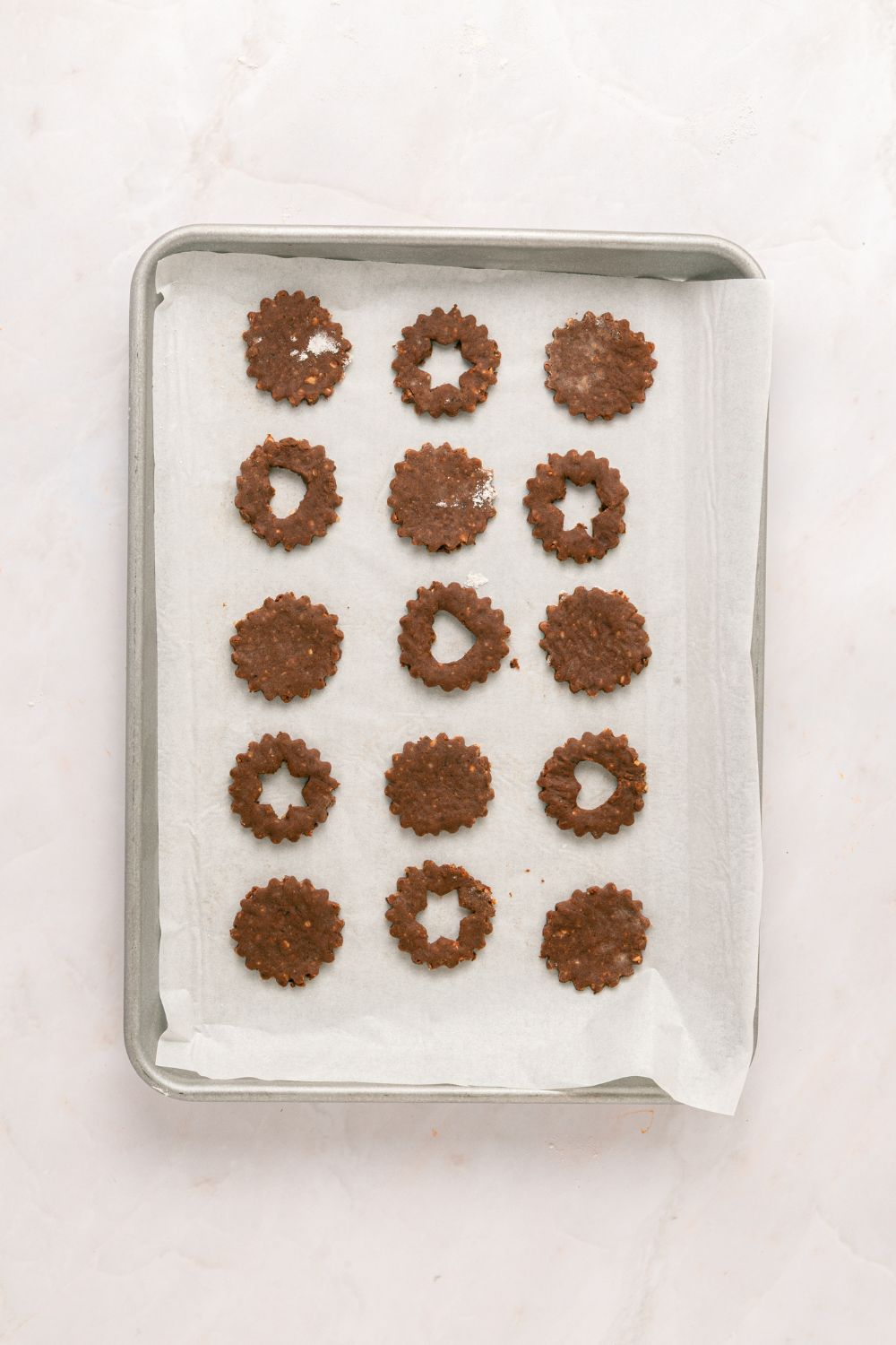 baking sheet with cooked Chocolate Linzer Cookies cooling 