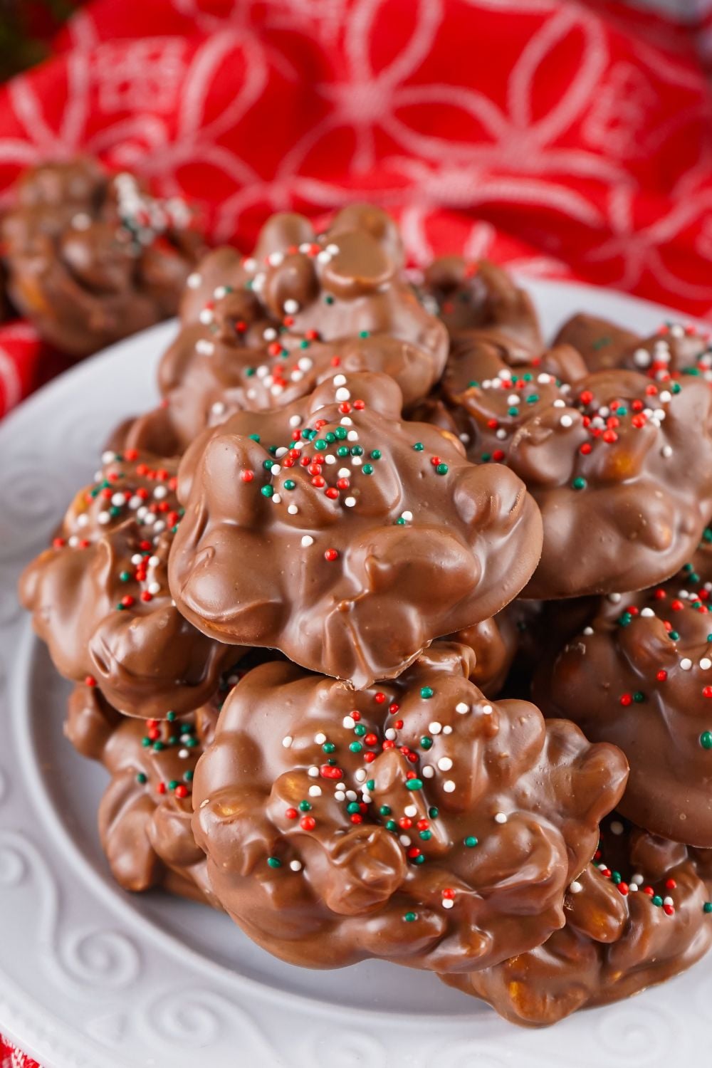 Crockpot Christmas Candy stacked on a white plate on table