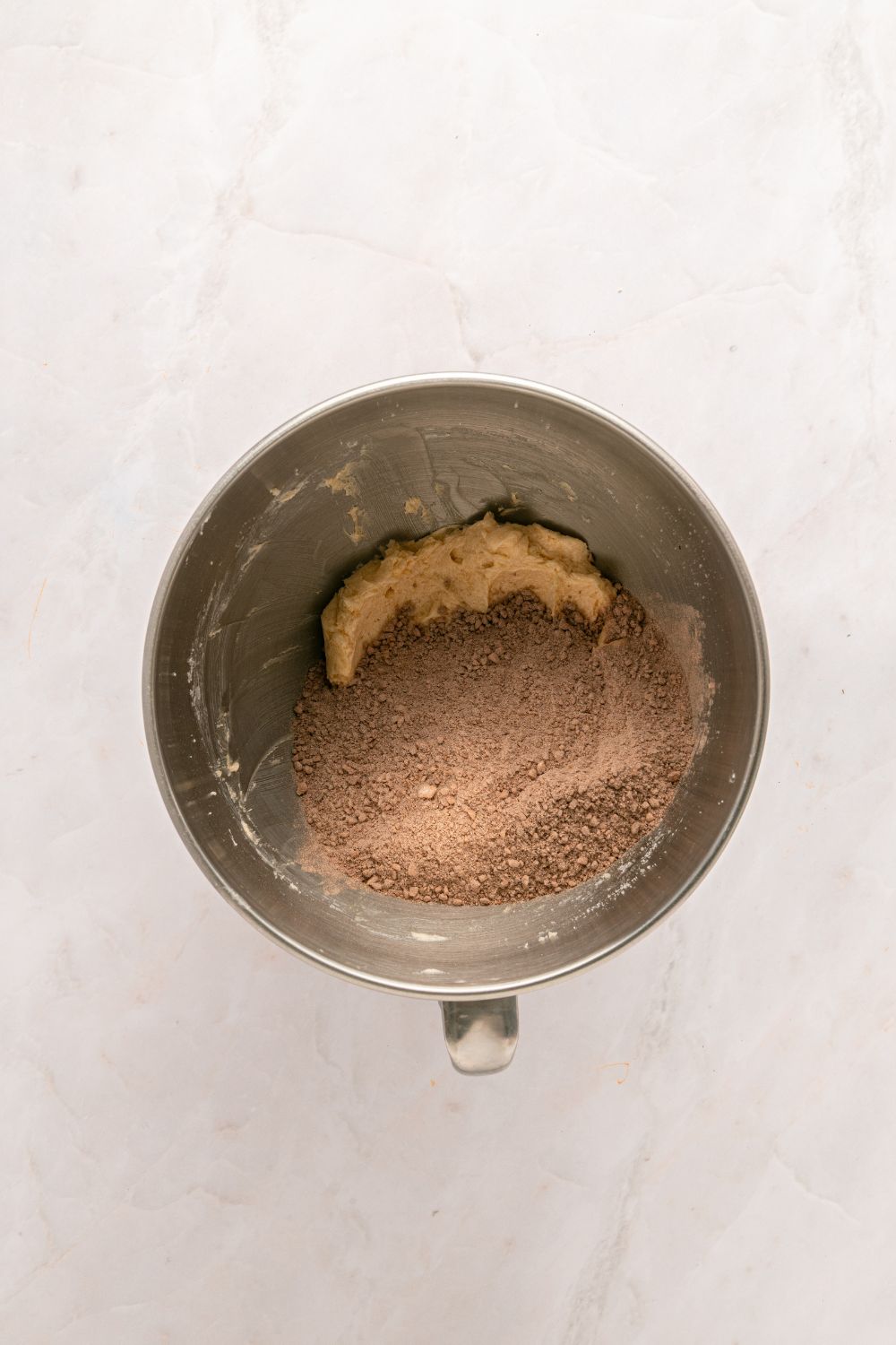 a metal mixing bowl with dry ingredients in a mixing bowl 