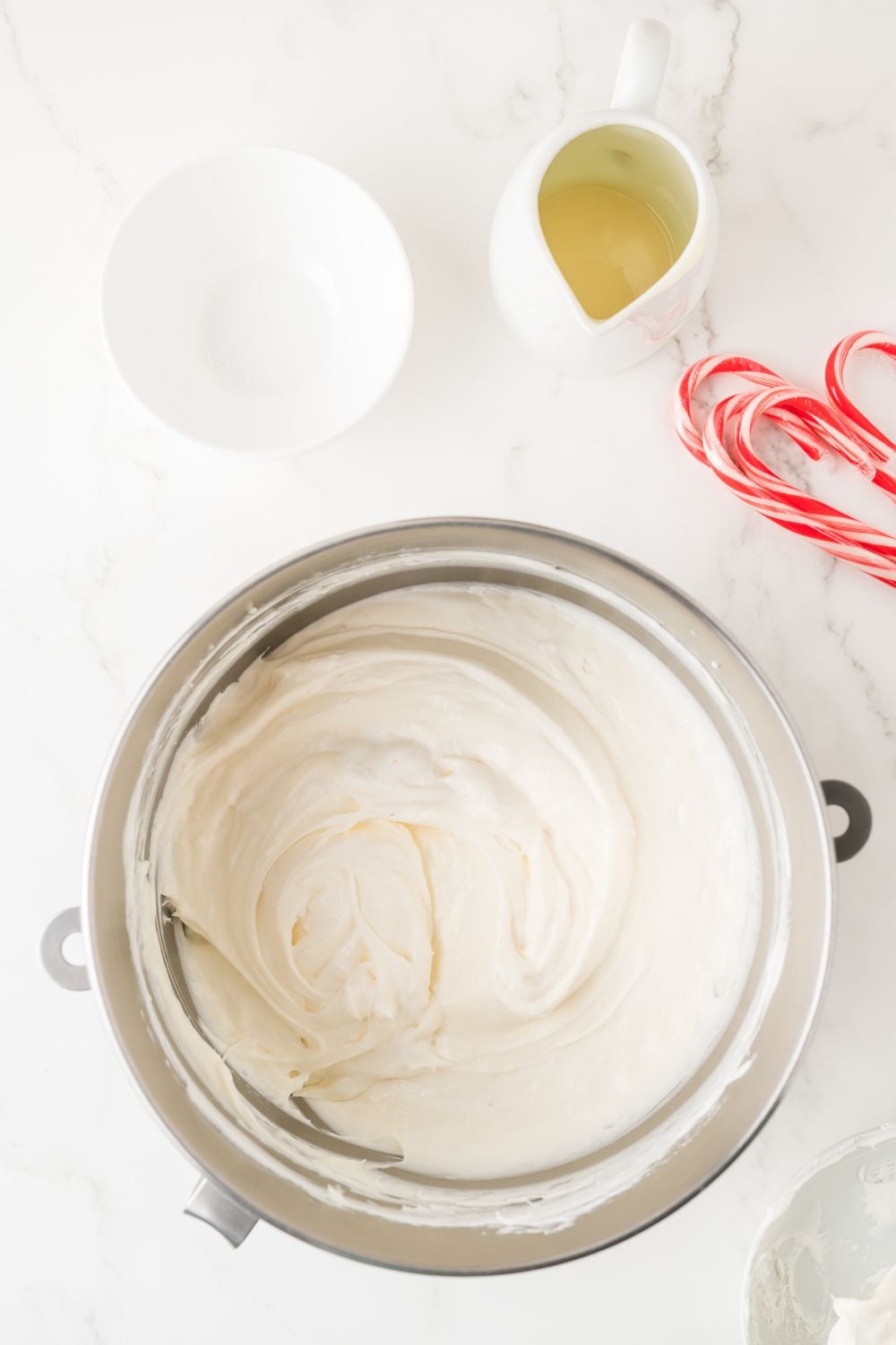No Bake Peppermint Cheesecake batter in a metal container on table 
