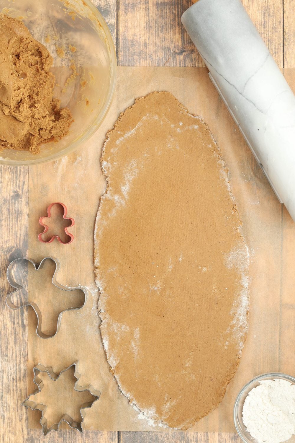 rolled out cookie dough on table 