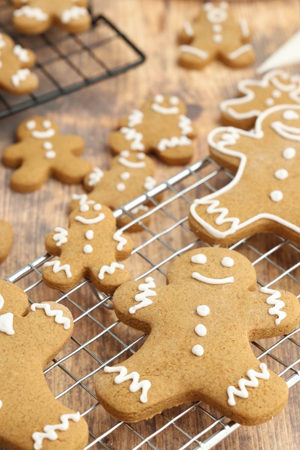 different sized gingerbread on a cooling rack on table 