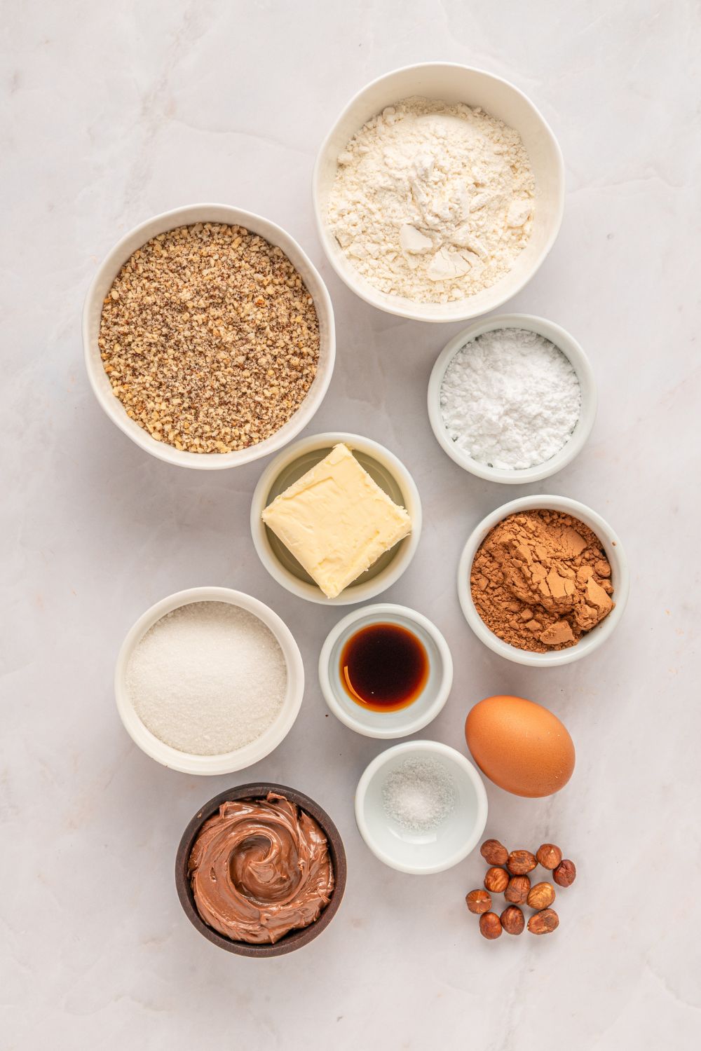 bowls of ingredients for Chocolate Linzer Cookies on the table 