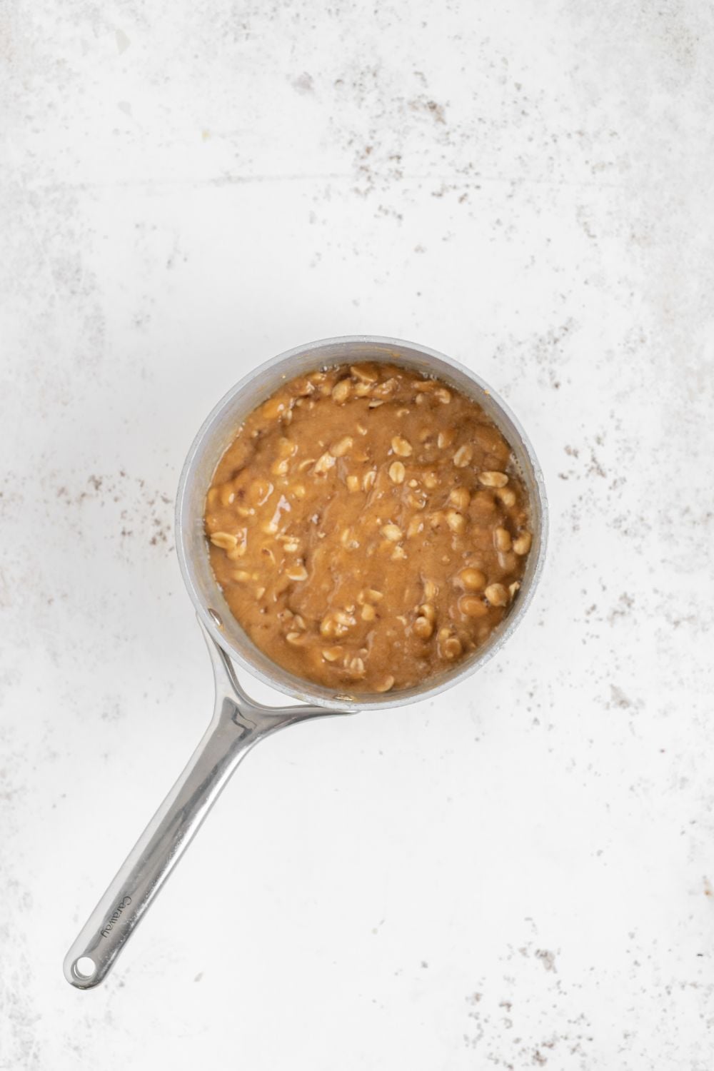 saucepan with Homemade Peanut Brittle cooking in it
