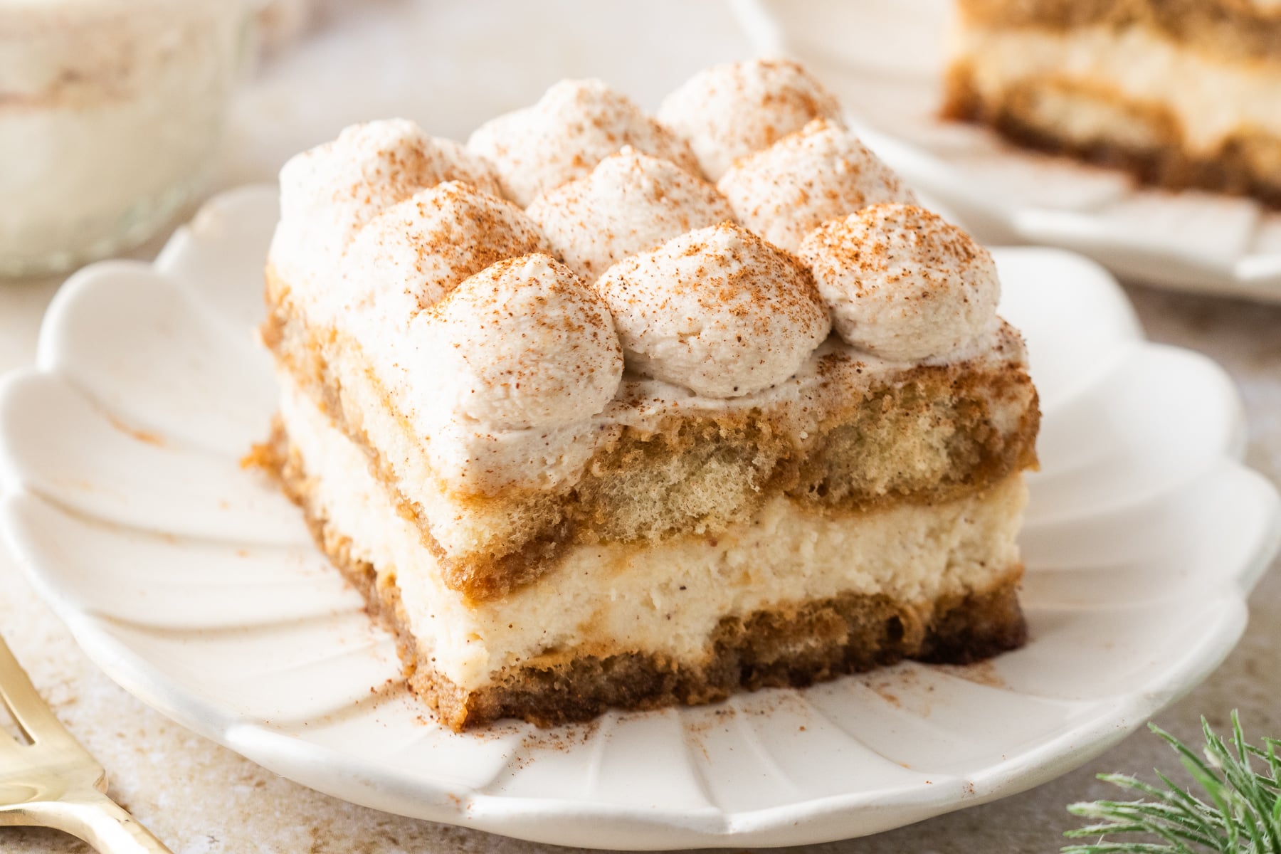 No Bake Eggnog Tiramisu sliced on white serving plates 