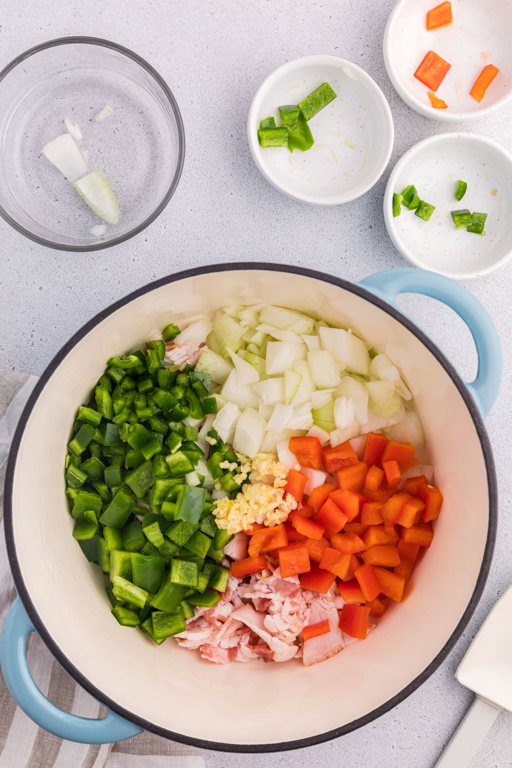 peppers and other veggies in a stockpot on the table