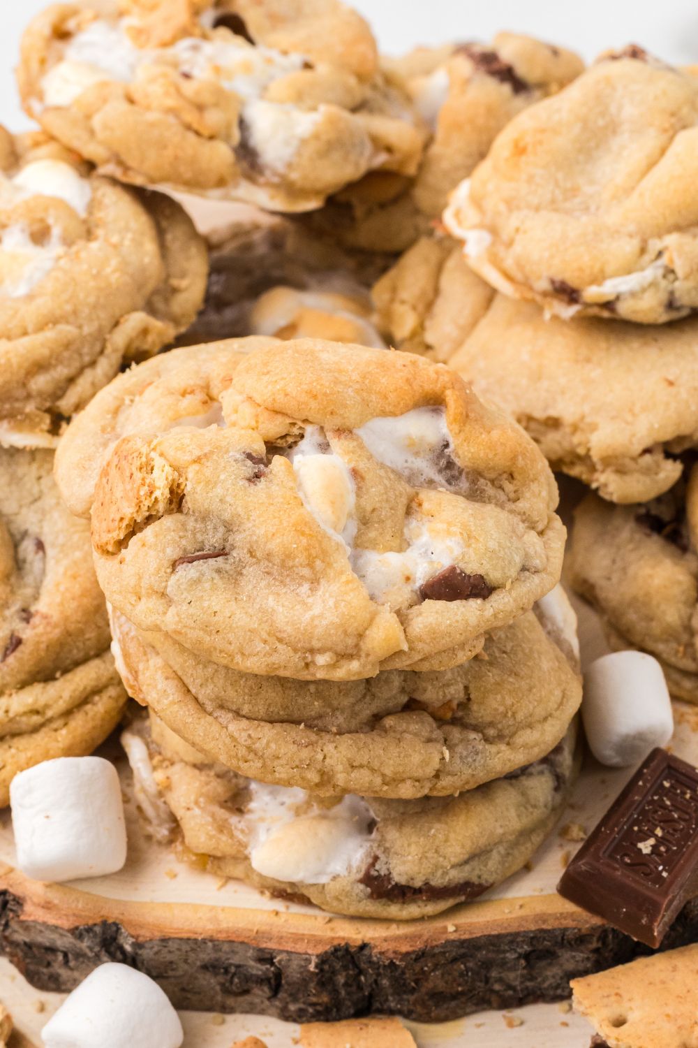 stacks of S'mores Cookies on table showing how many the cookies make and marshmallows