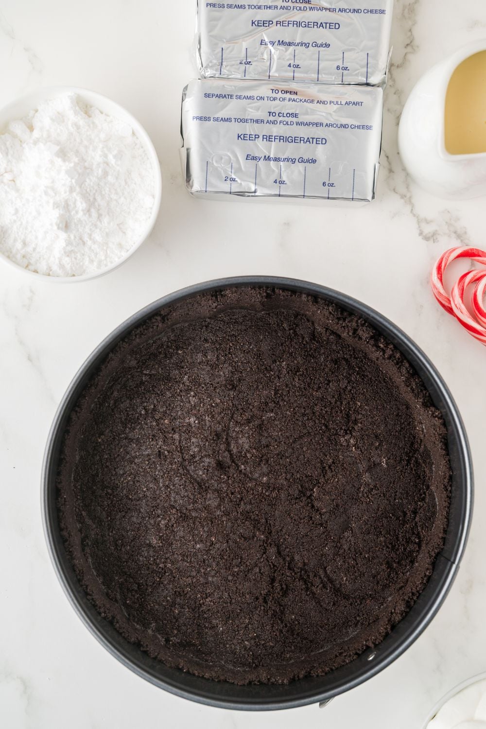 oreo cookie pie crust in pan on table 