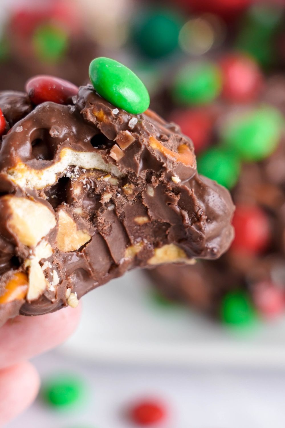 Crockpot Chocolate Pretzel Christmas Candy with a bite taken out of it
