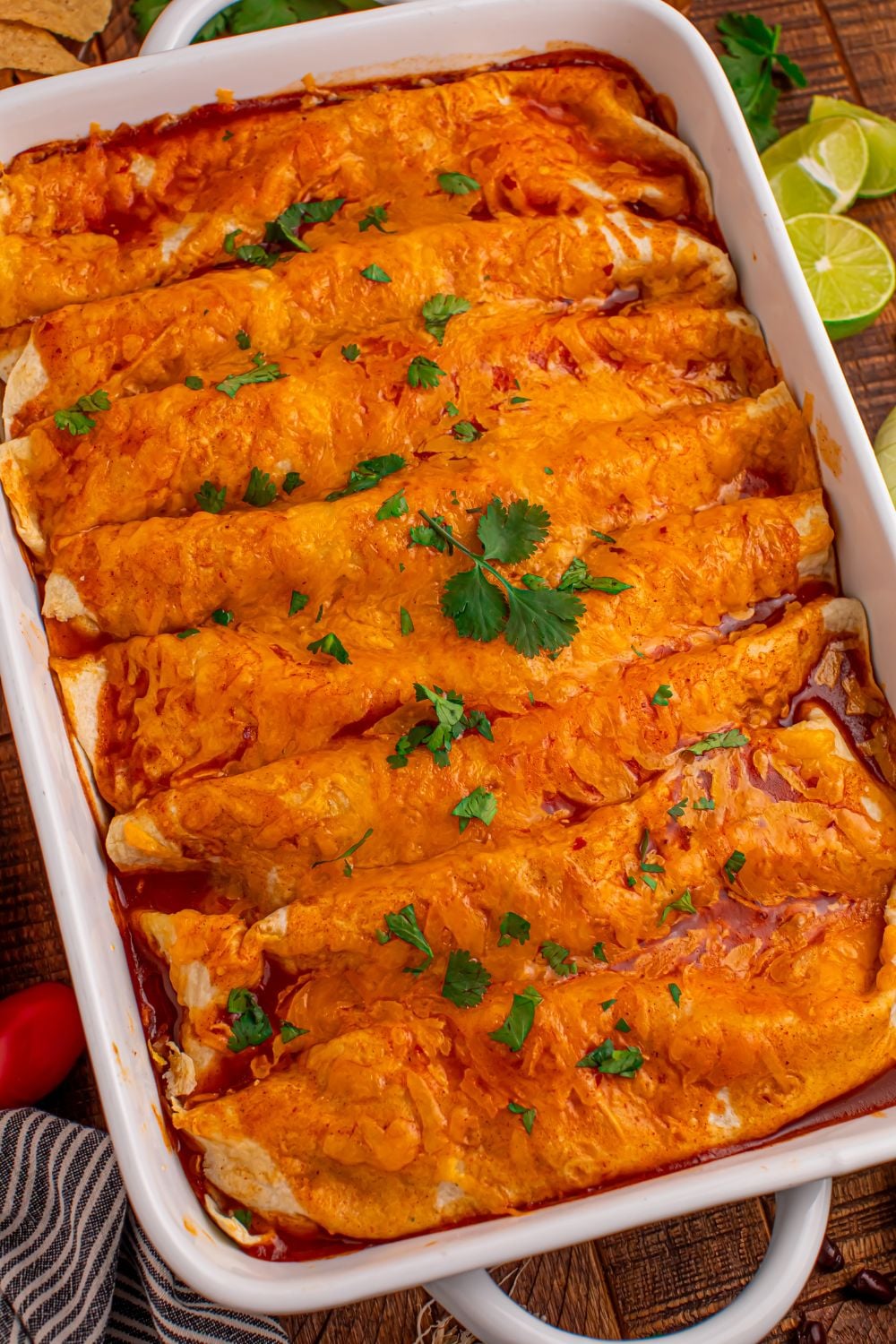 Steak Enchiladas in a casserole dish with cilantro sprinkle on top