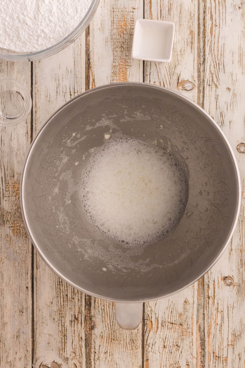 sugary mixture of for making royal icing in a metal bowl