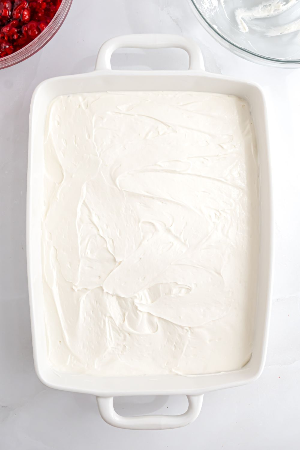 whipped topping spread over the casserole for making a pretzel salad