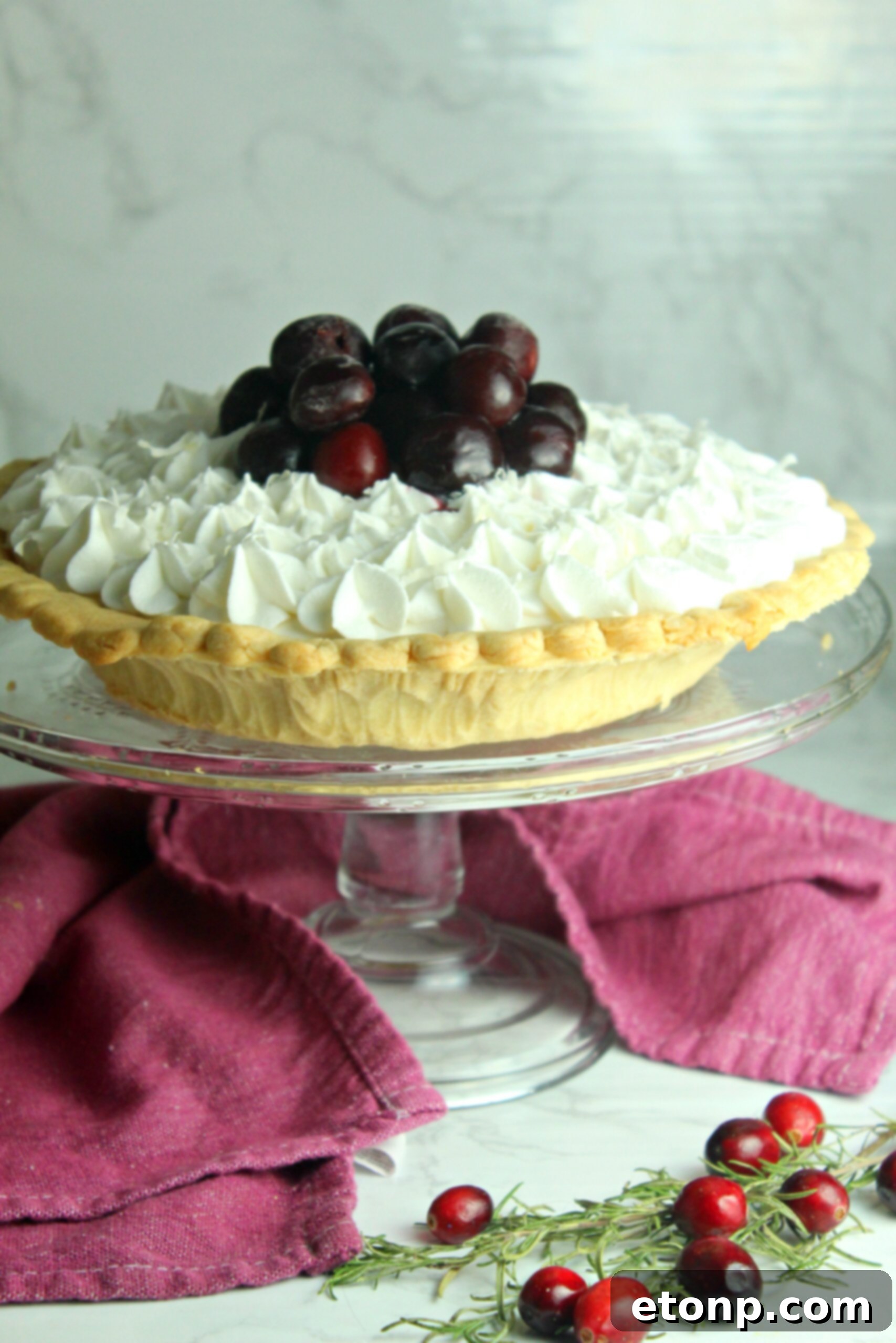 The White Christmas Pie, sliced and served on a festive plate, illustrating its enticing creamy texture and perfect portioning. Ideal for Christmas dinner.