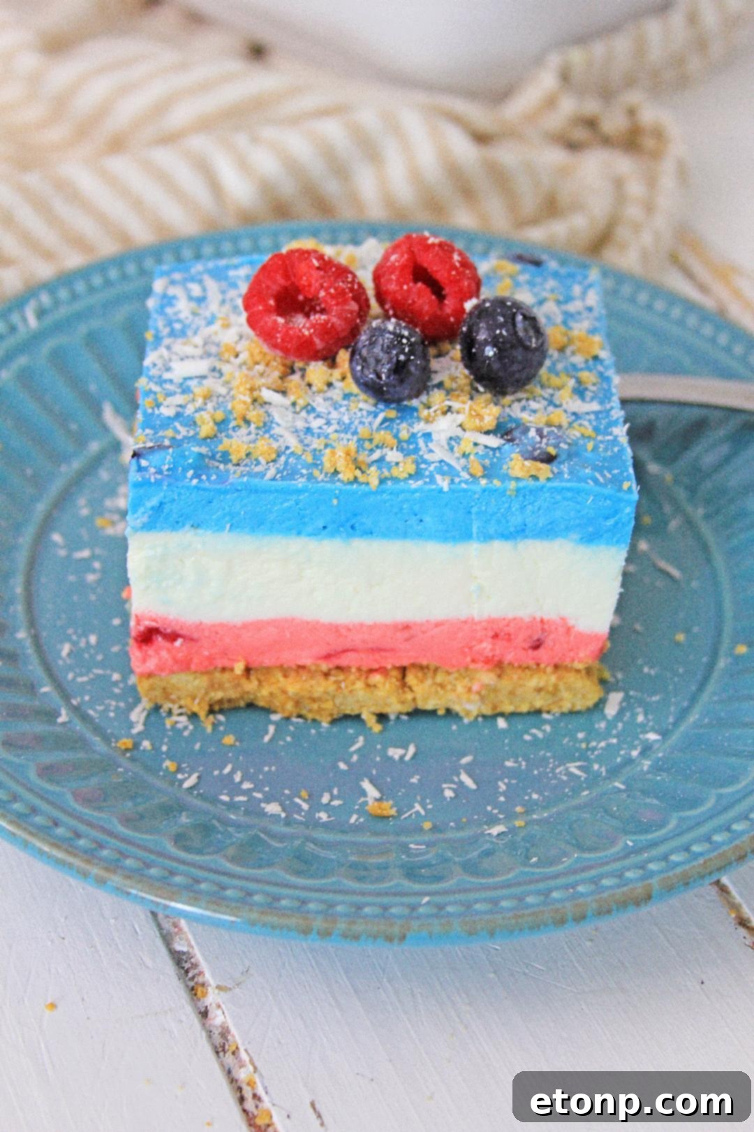 Another view of the No-Bake Berry Cheesecake Lasagna with fresh berries as garnish.