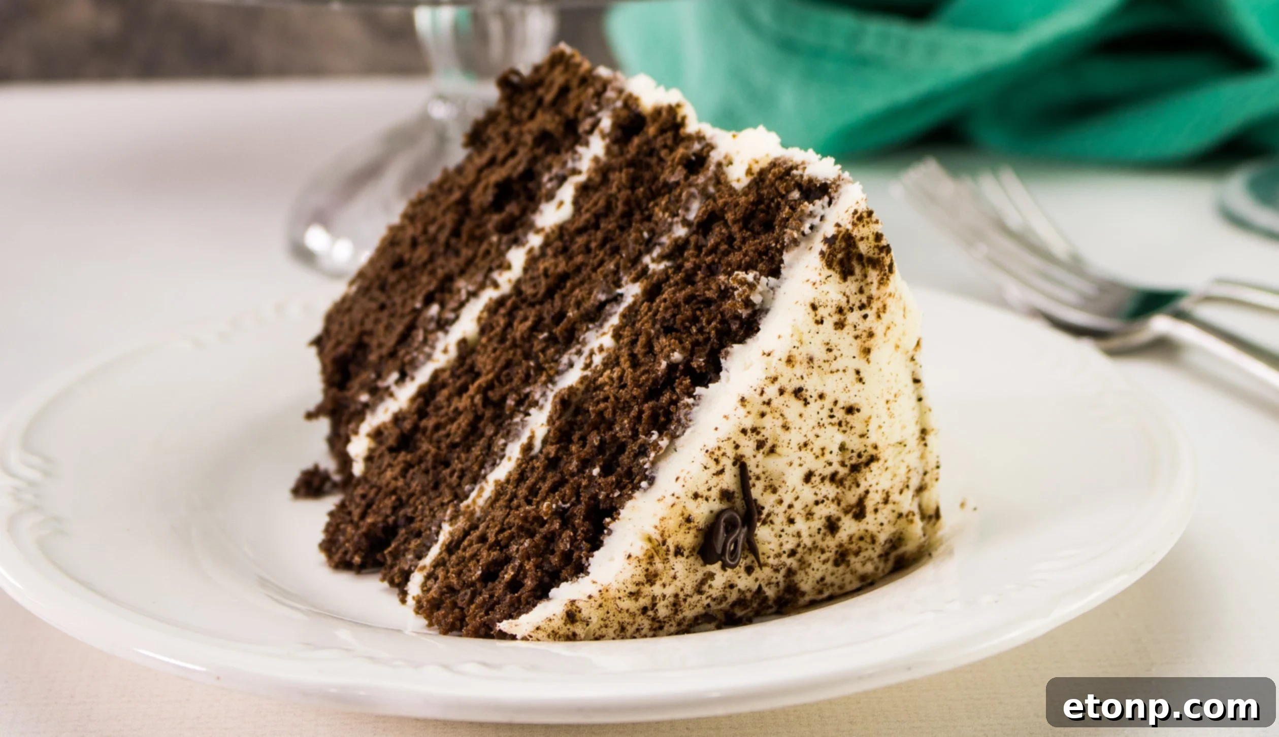The finished Bailey's Irish Cream Chocolate Cake, adorned with elegant frosting swirls, ready to be served.