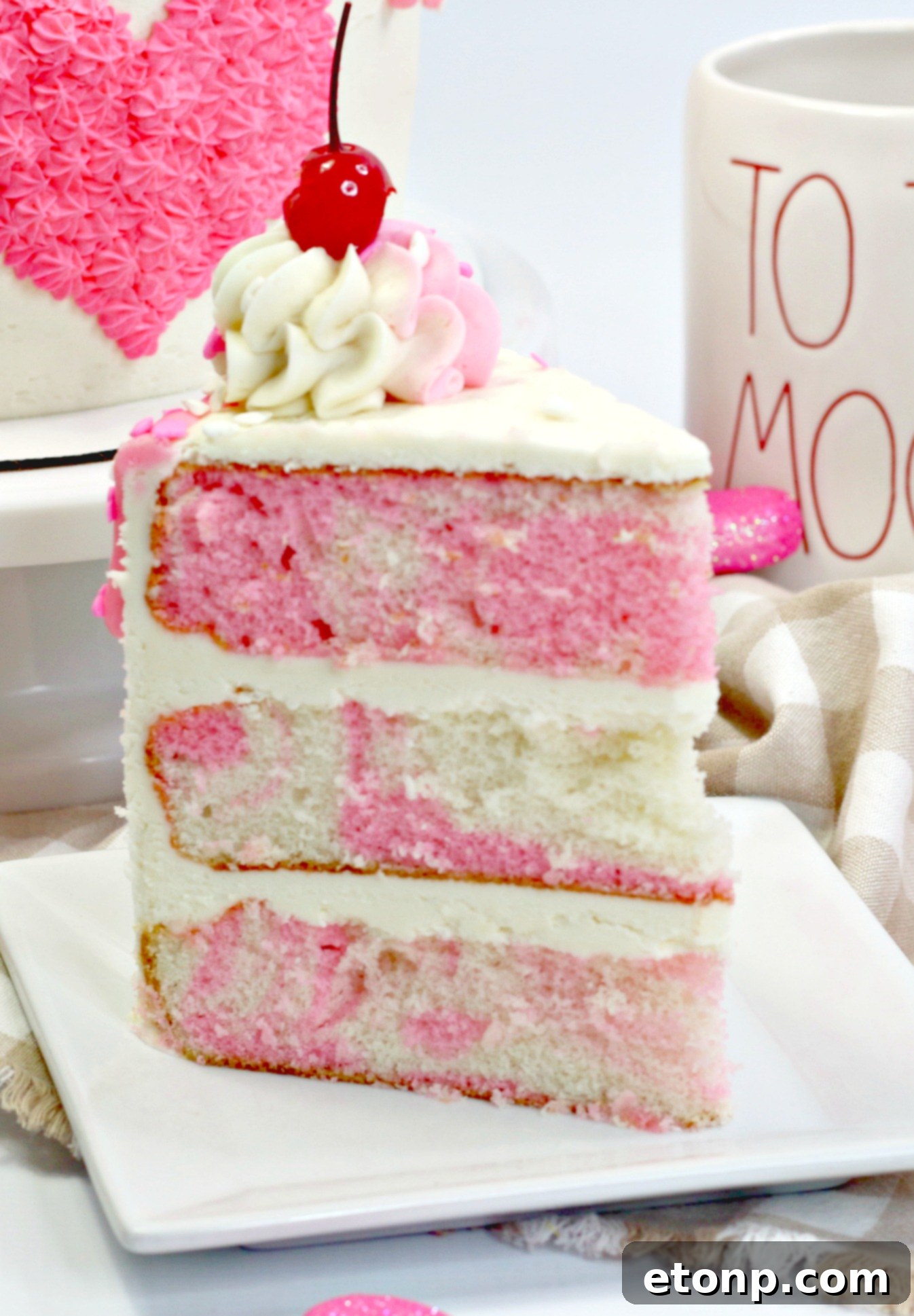 A beautifully presented slice of Valentine's Day Love Cake on a plate, ready to be enjoyed.