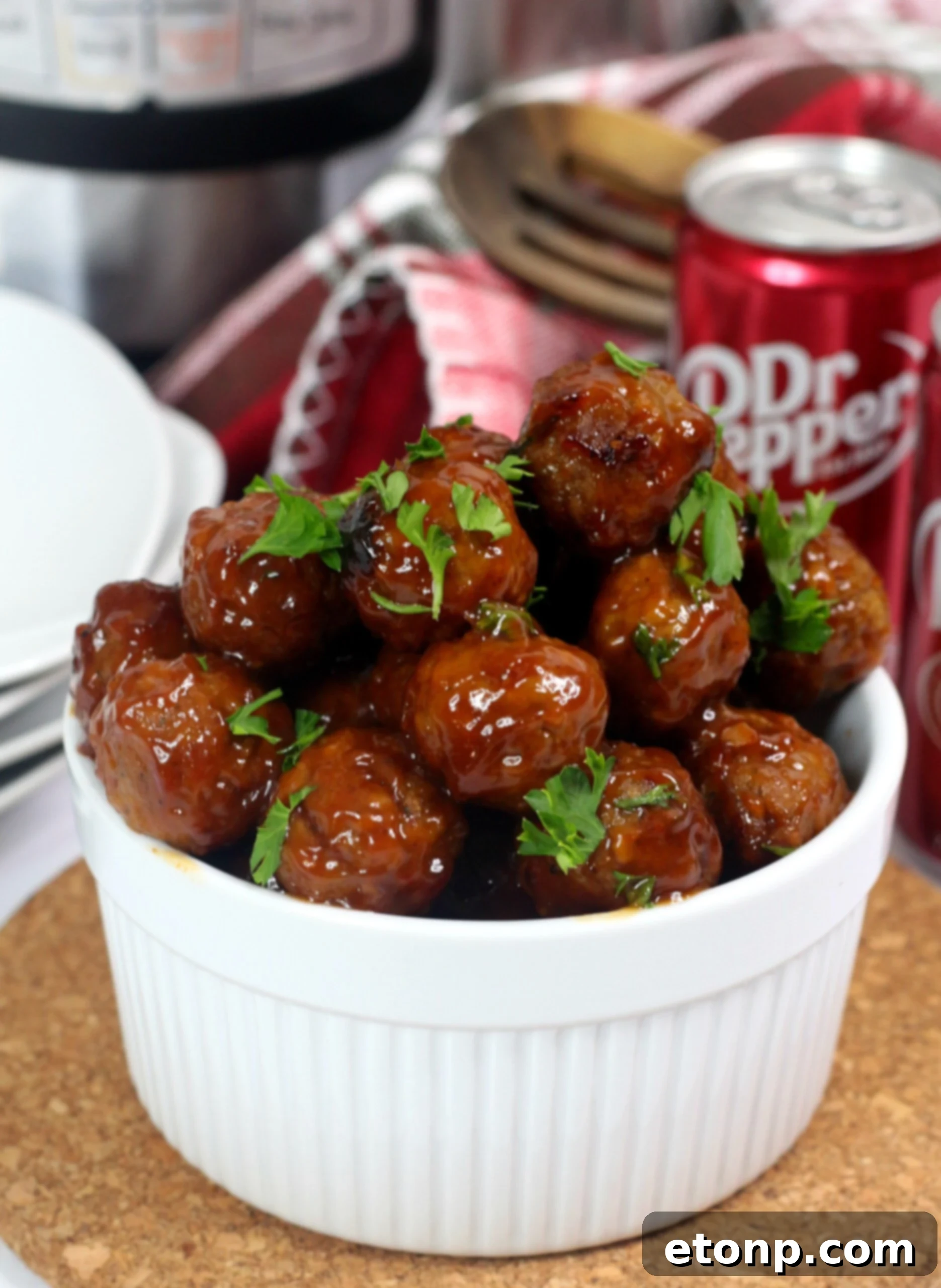 Individual Dr Pepper Meatballs, beautifully garnished and ready to be enjoyed as a delightful appetizer.