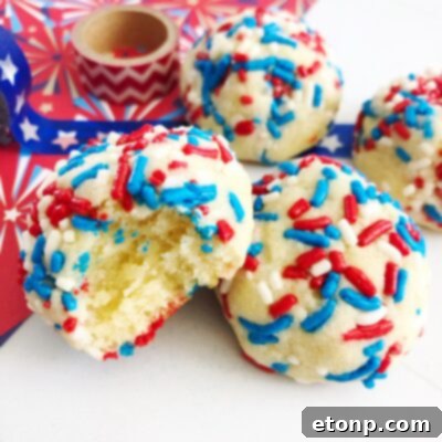 A beautifully arranged stack of Sprinkle Butter Cookies, adorned with colorful sprinkles.