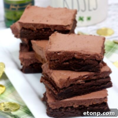 Close-up of a single Irish fudge brownie with chocolate whiskey buttercream frosting