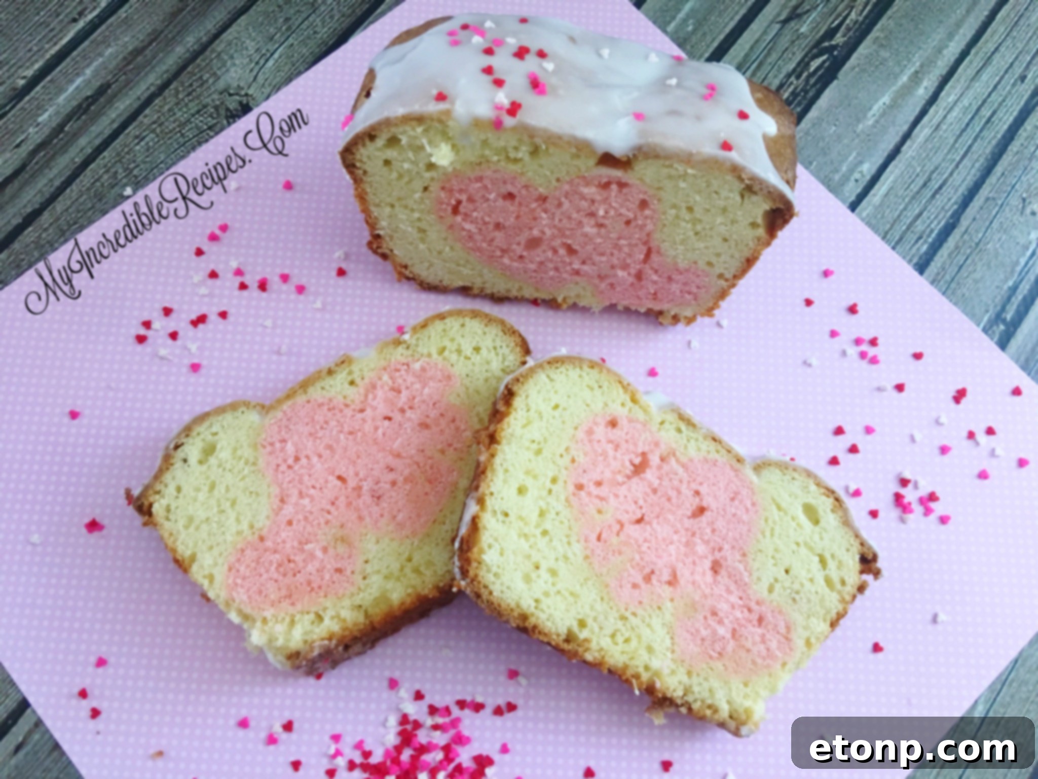 Sliced pound cake revealing a pink heart