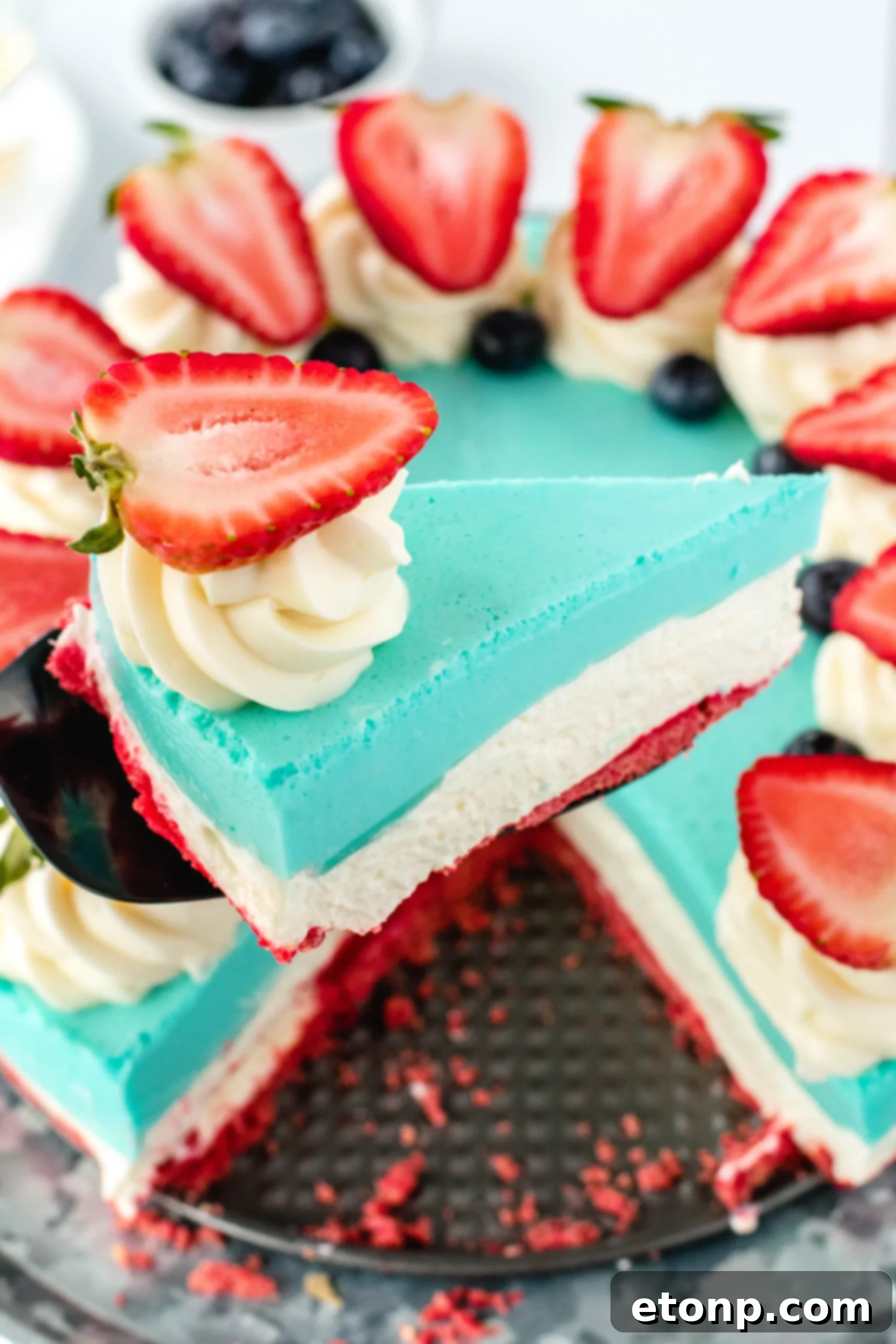 Whole No-Bake Patriotic Cheesecake on a stand