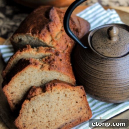 A freshly baked loaf of Simple Banana Bread, sliced and ready to enjoy.
