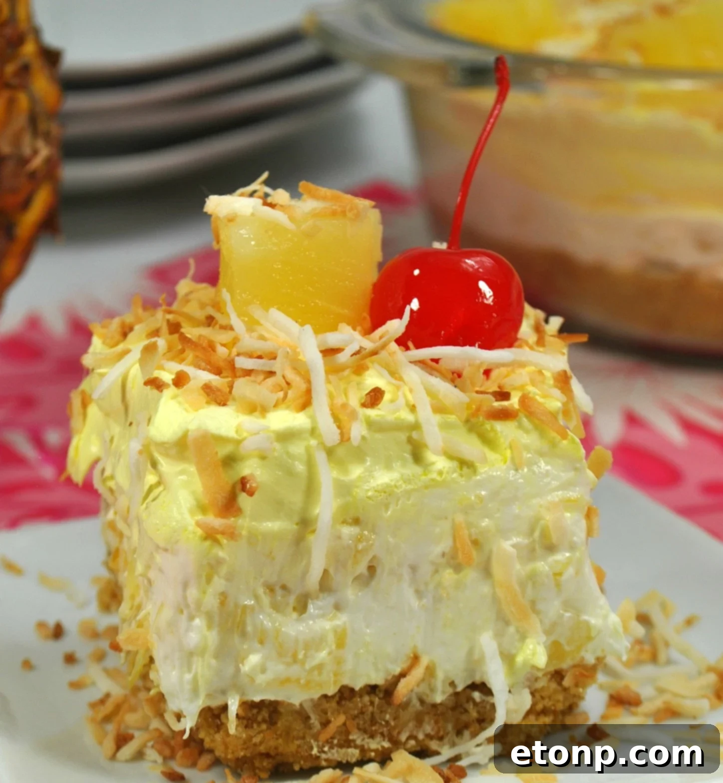 No Bake Pineapple Dream Dessert - Top view of a square dish with pineapple dessert