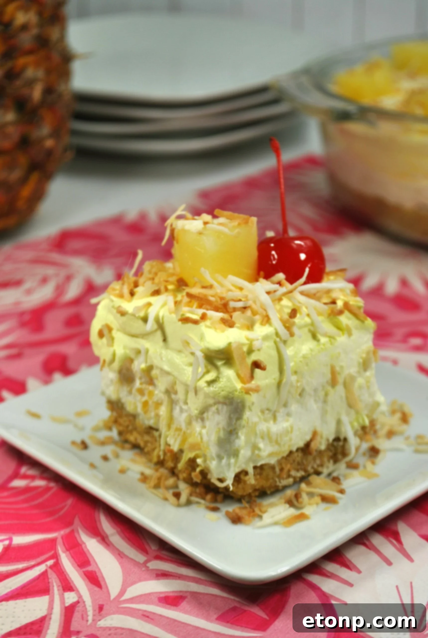 Side view of the pineapple dessert with a spoon, highlighting its fluffy texture